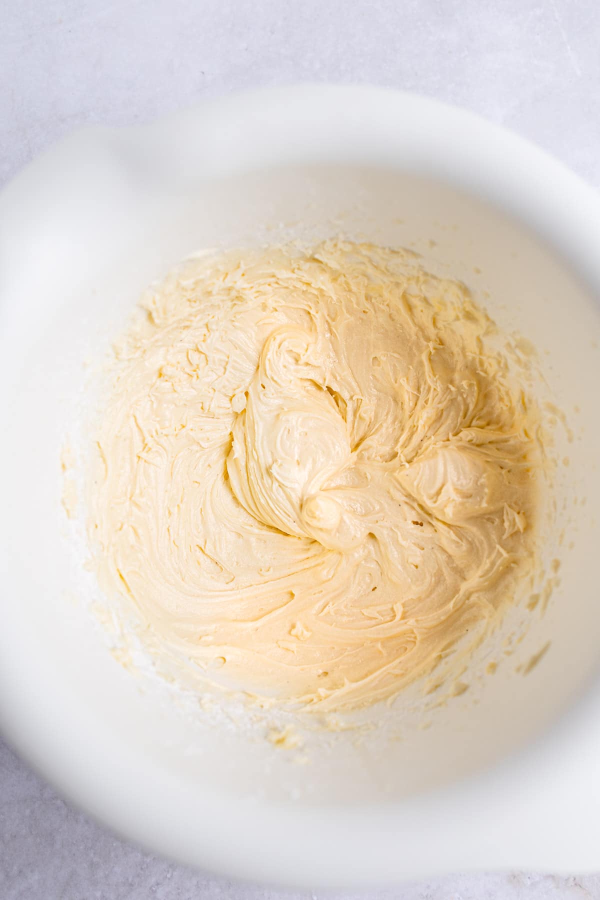 Buttercream in a white mixing bowl. 