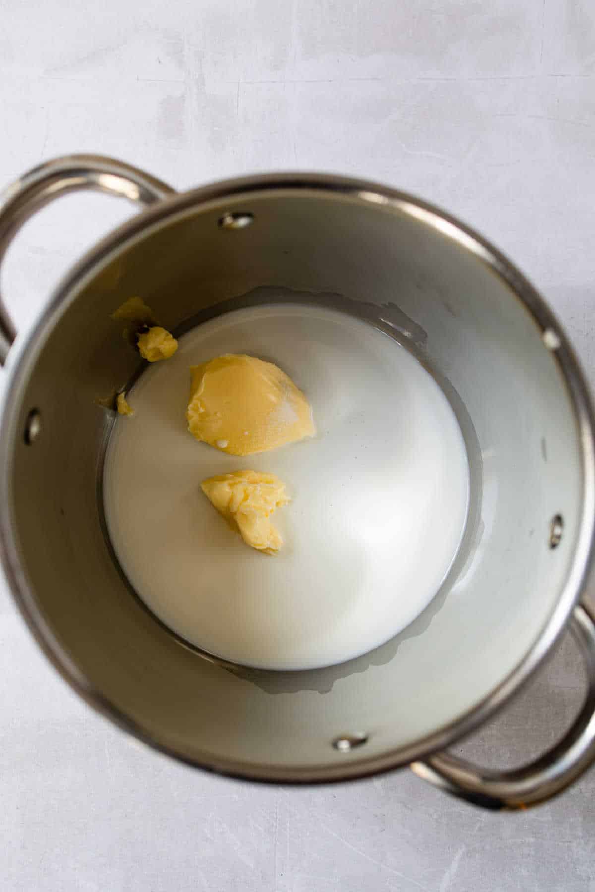 Milk and butter in a saucepan.