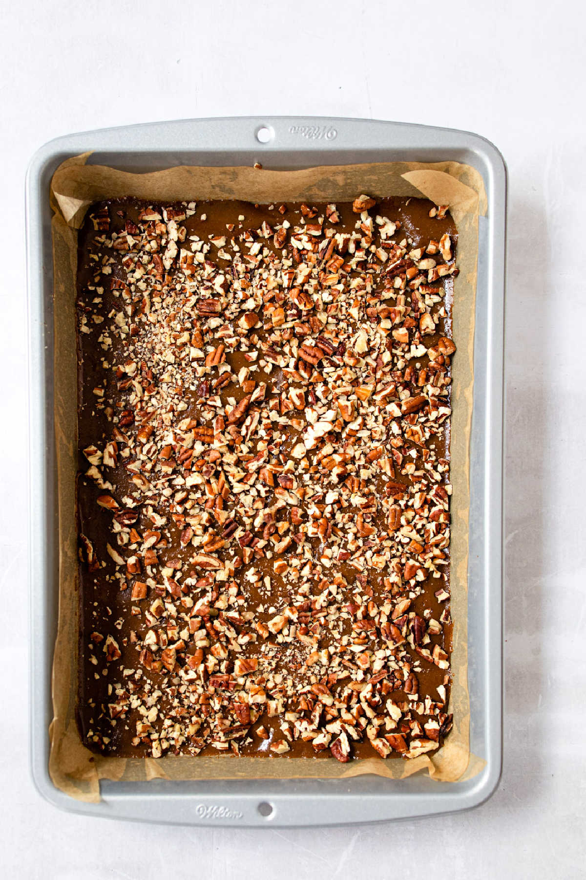 Caramel nut topping in a baking pan. 