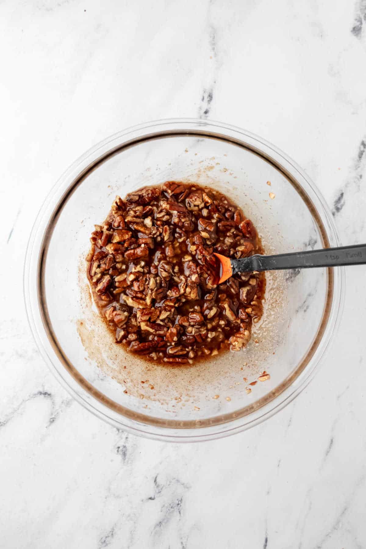 Mixed nut filling in a glass dish.