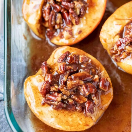 Baked apples in a glass baking dish.