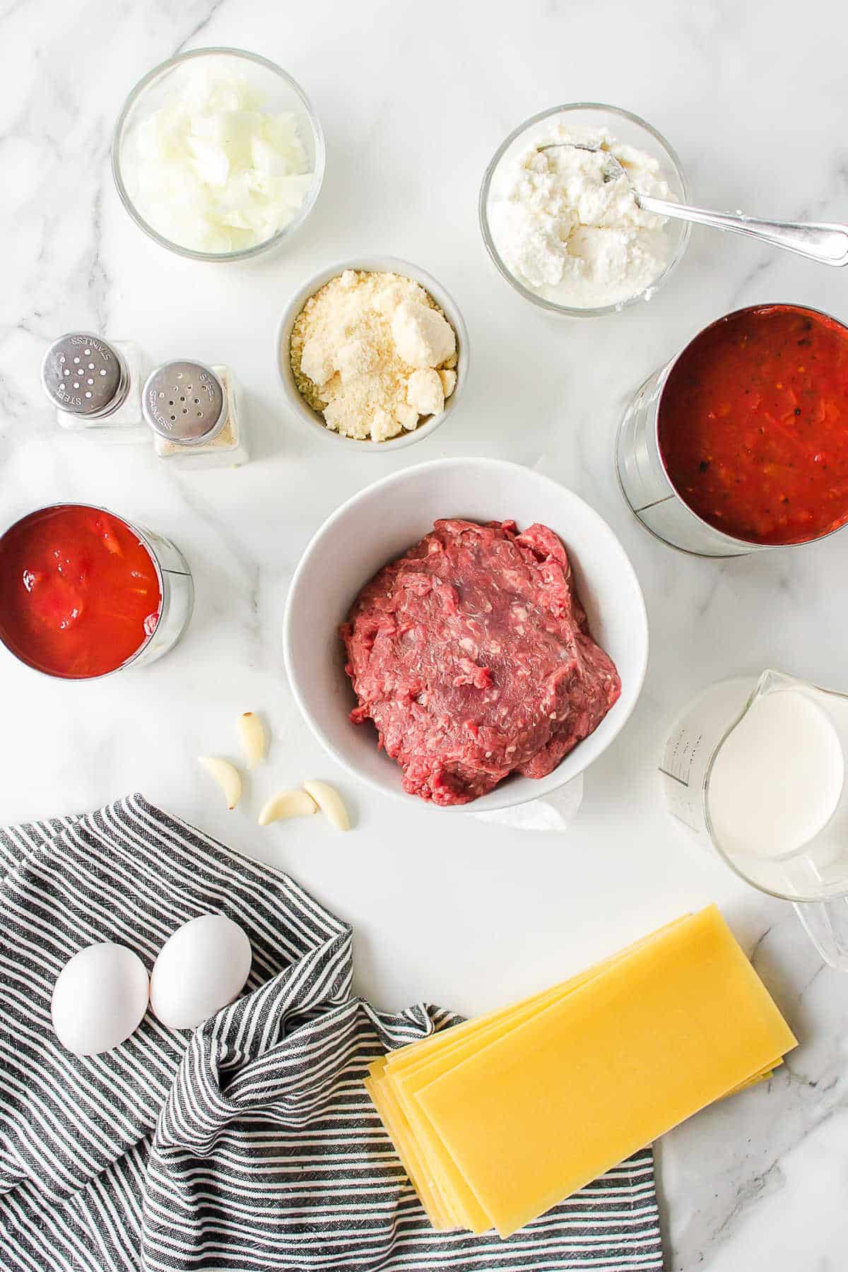 Ingredients for freezer lasagna in dishes. 