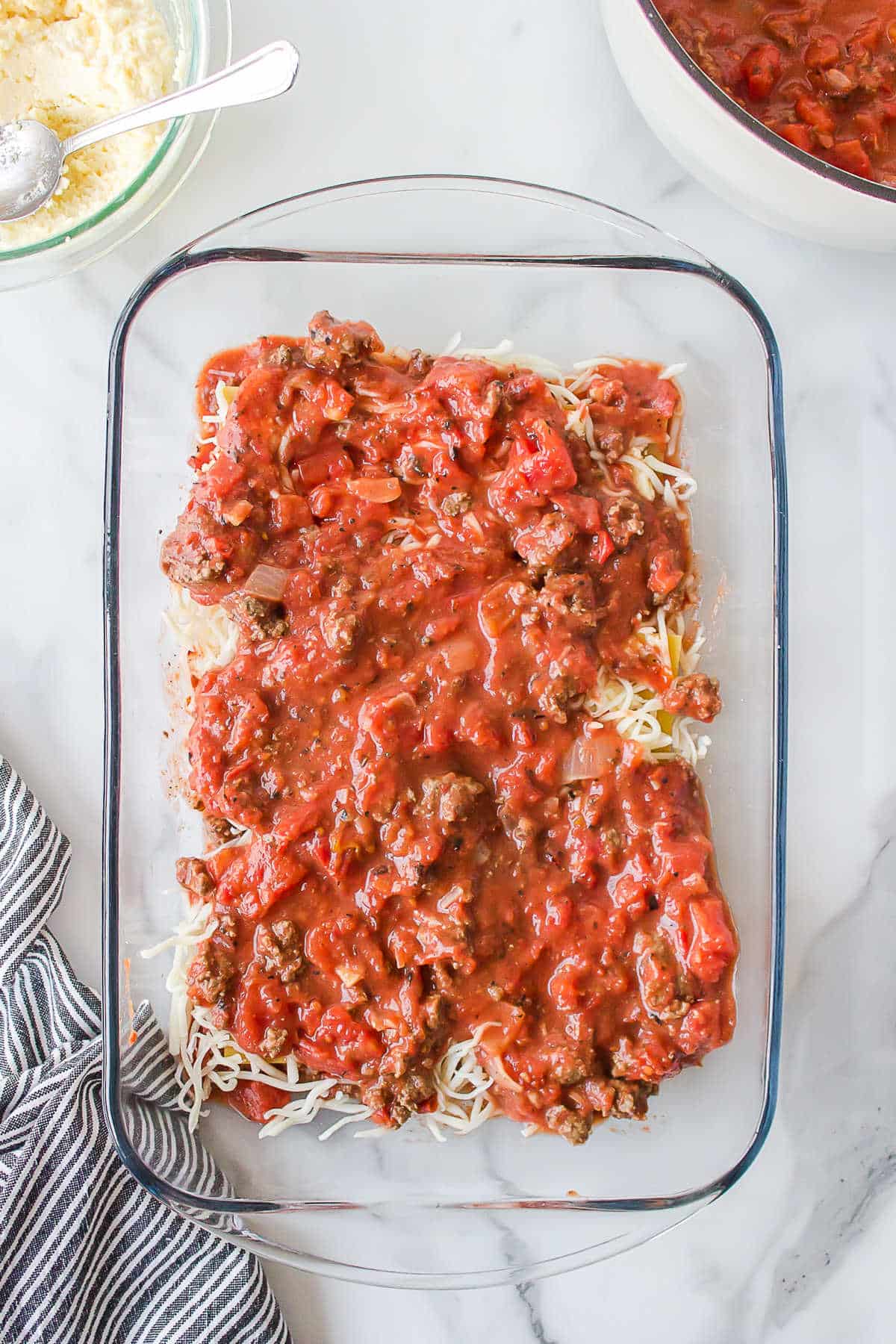 Red sauce over lasagna noodles. 