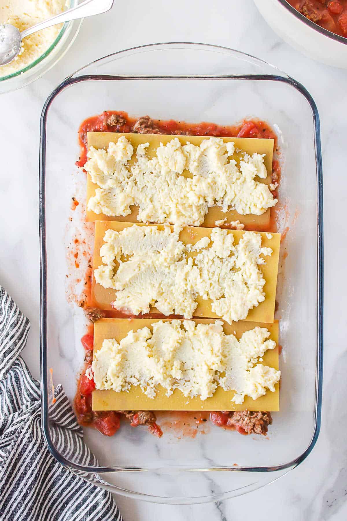 Ricotta mixture on top of no boil lasagna noodles. 