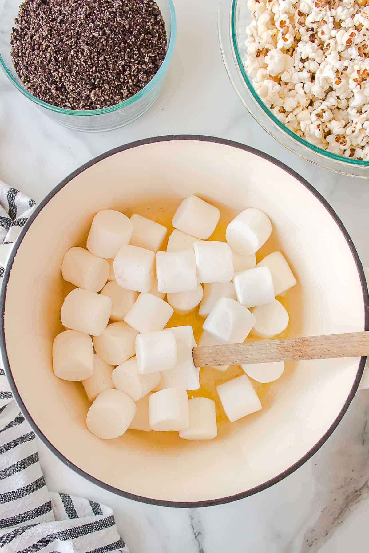 Melting marshmallows in a Dutch oven.