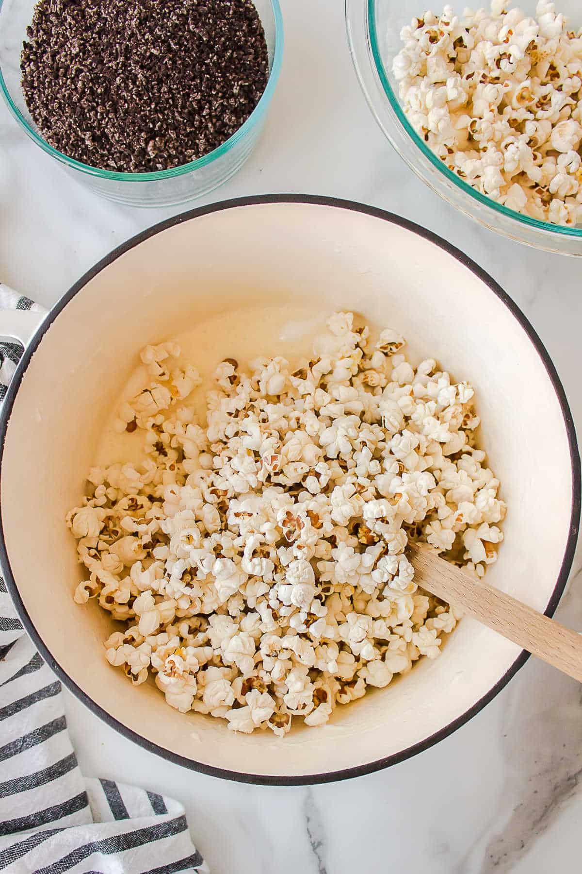Popcorn mixed into melted marshmallow. 