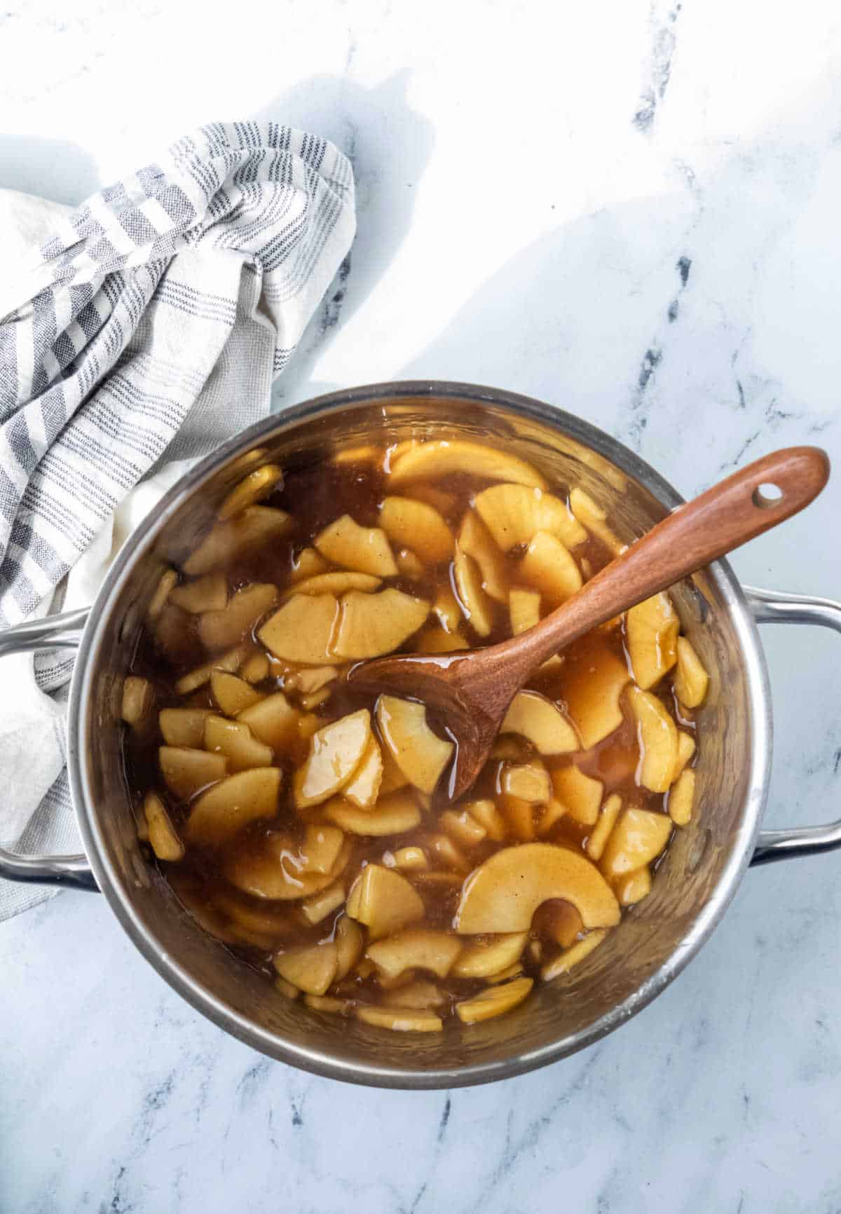 Apple pie filling in a saucepan.