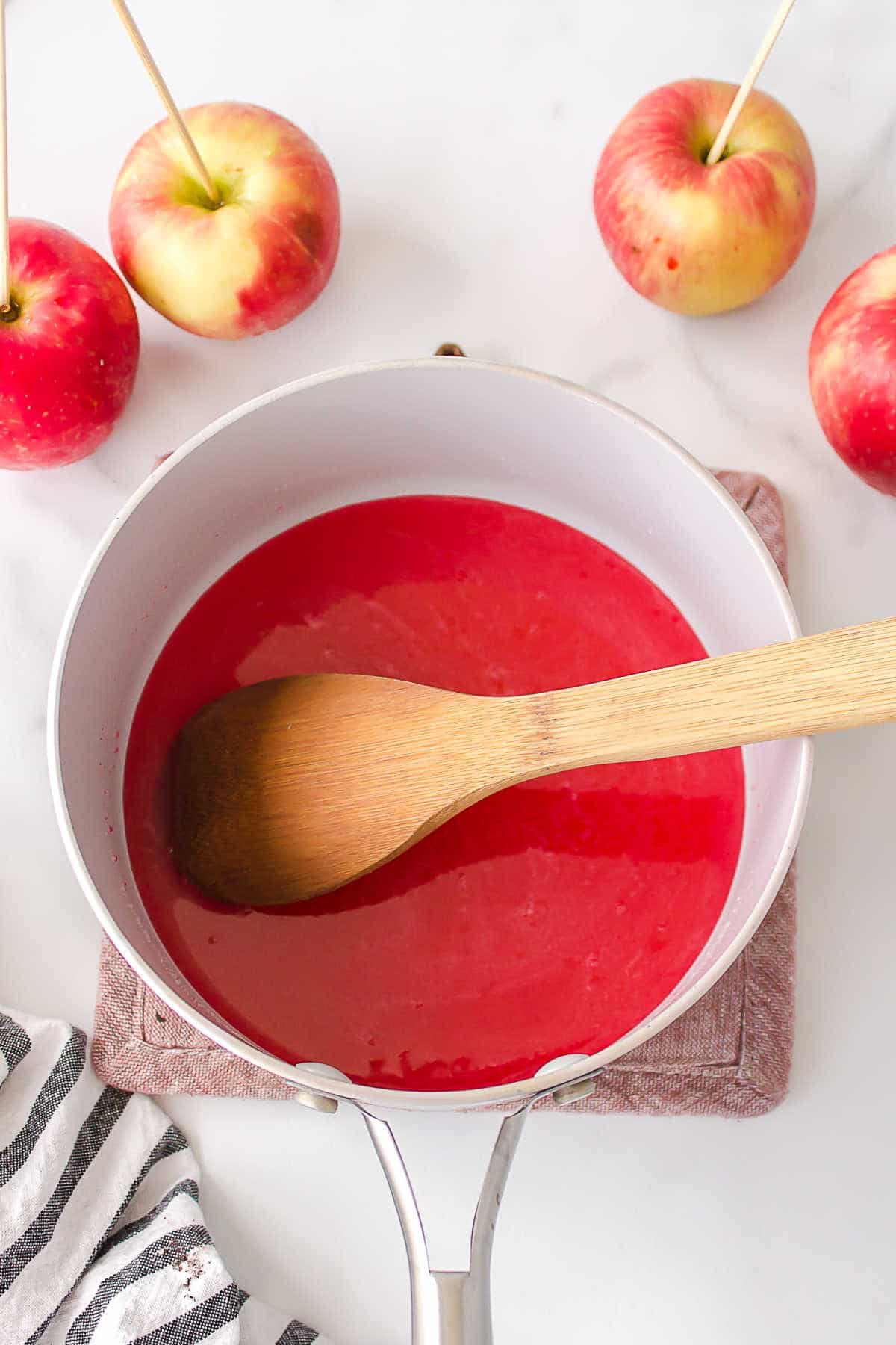 Red food coloring stirred into candy mixture. 