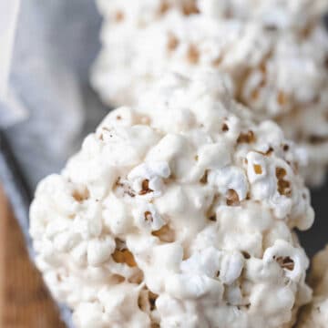 Popcorn ball in a metal dish.