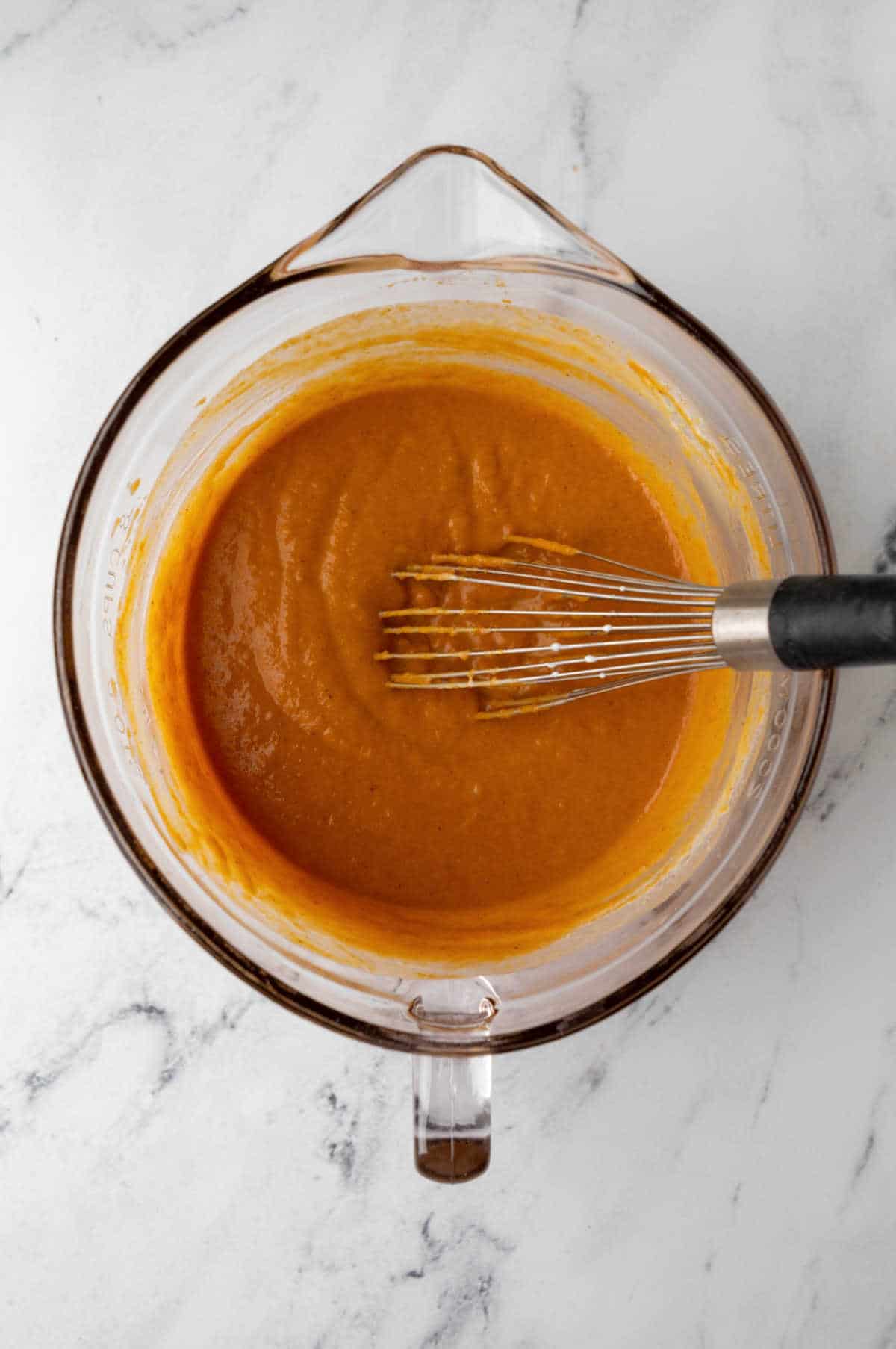Cream mixed into pumpkin pie mixture.