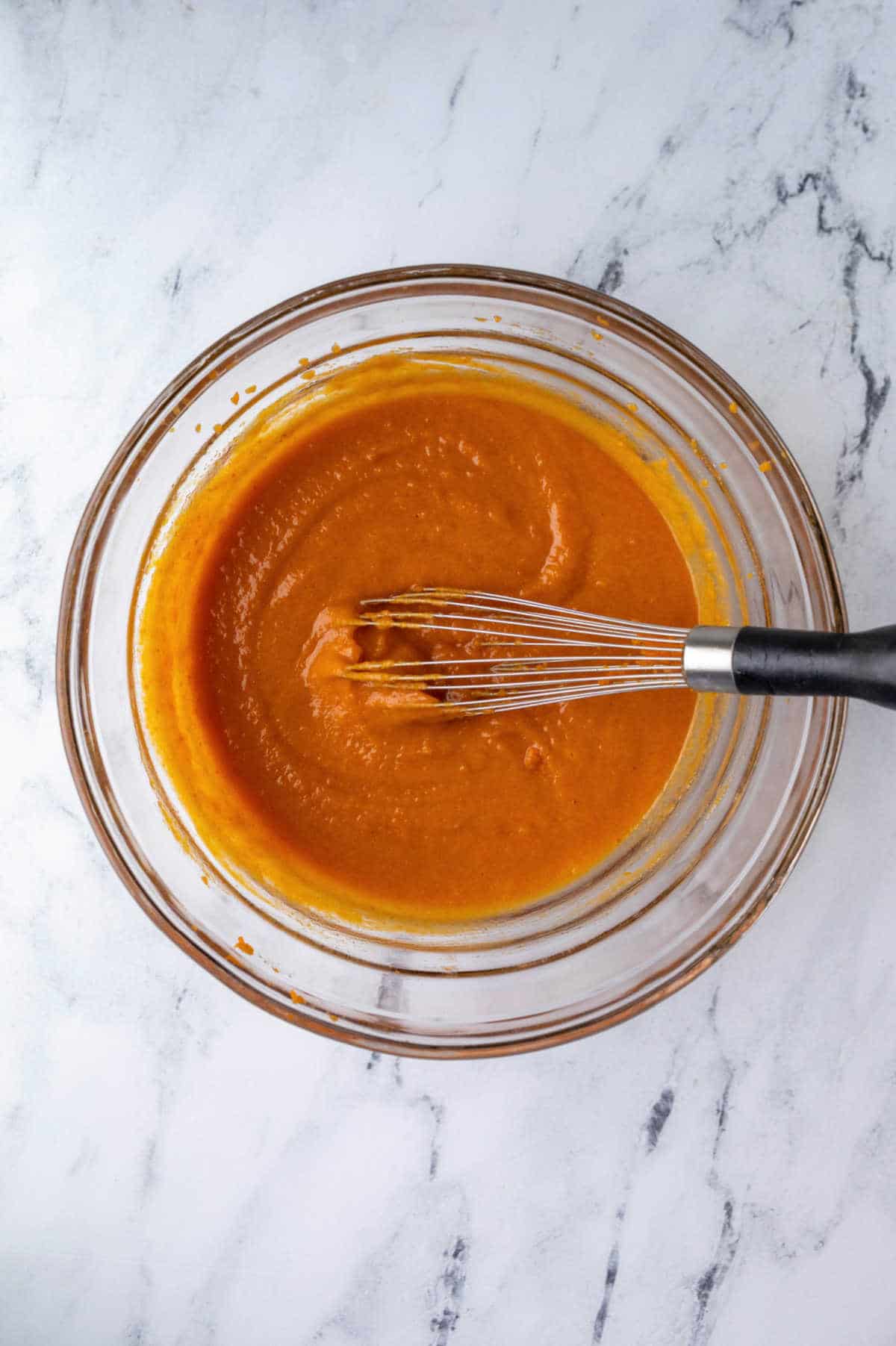 Pumpkin puree whisked into oil and eggs.