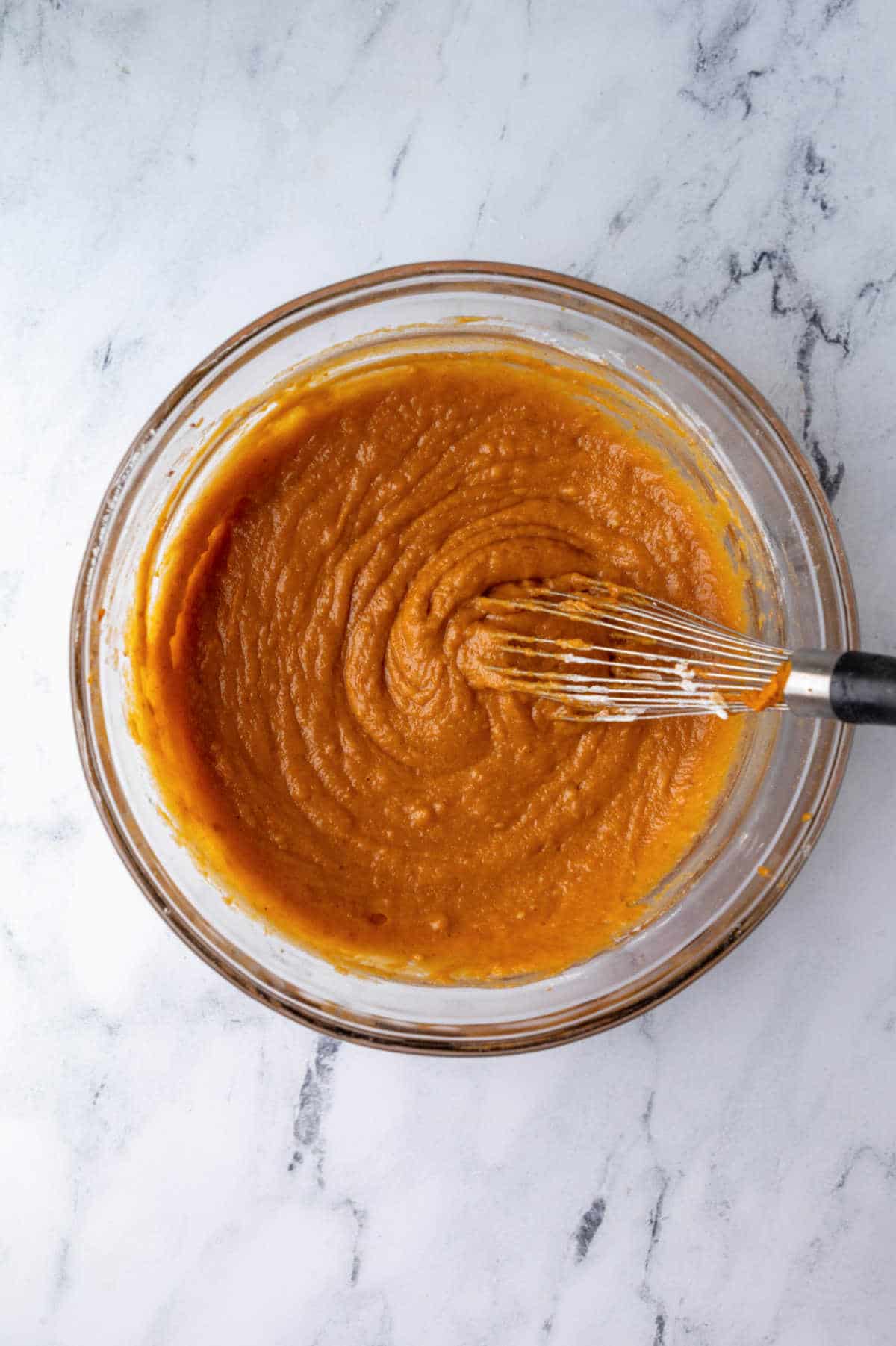 Pumpkin bread batter in a mixing bowl.