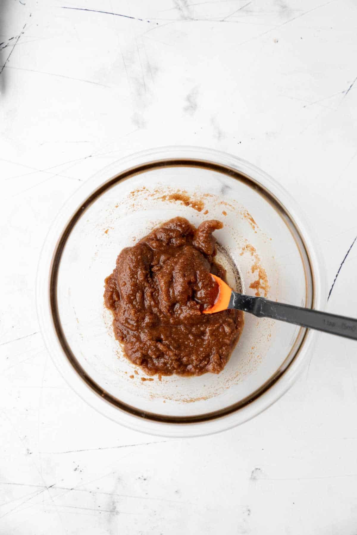 Brown sugar granulated sugar spices and maple syrup in a bowl. 