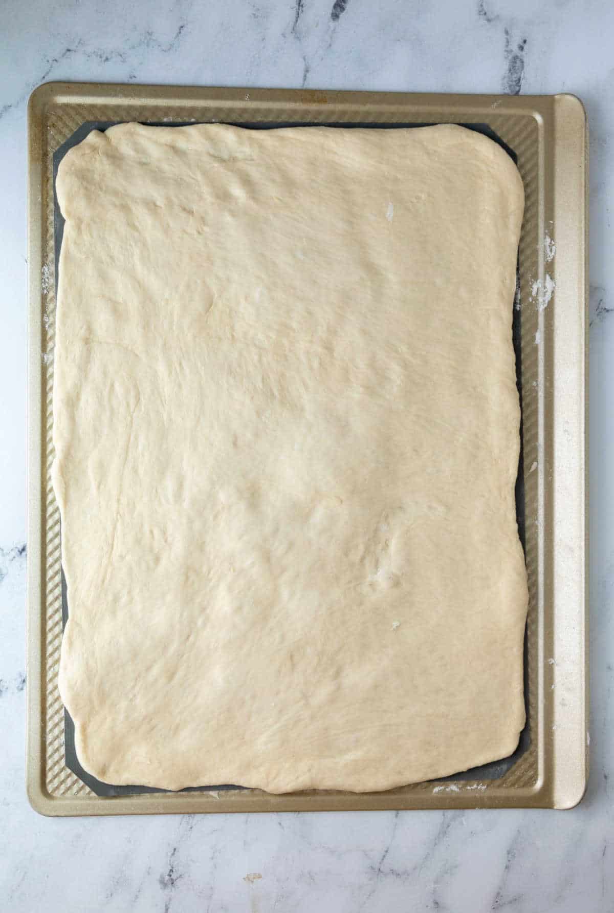 Sticky bun dough rolled into a rectangle. 