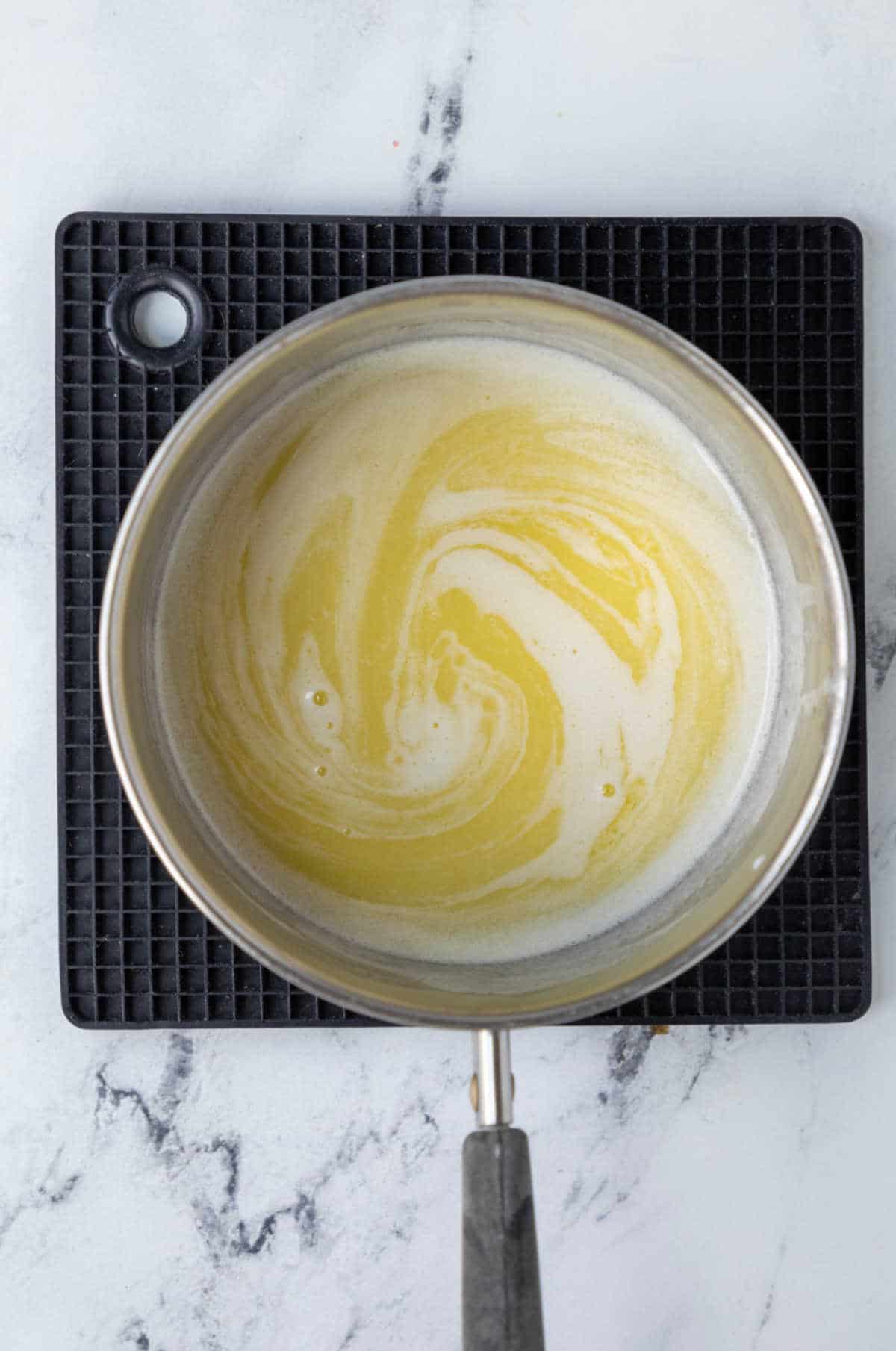 Melted butter and milk in a saucepan.