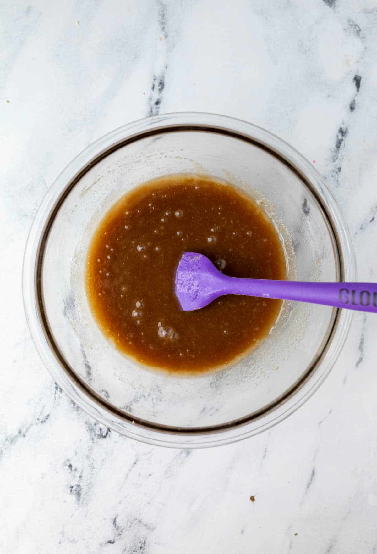 Maple sticky bun topping in a glass mixing bowl. 