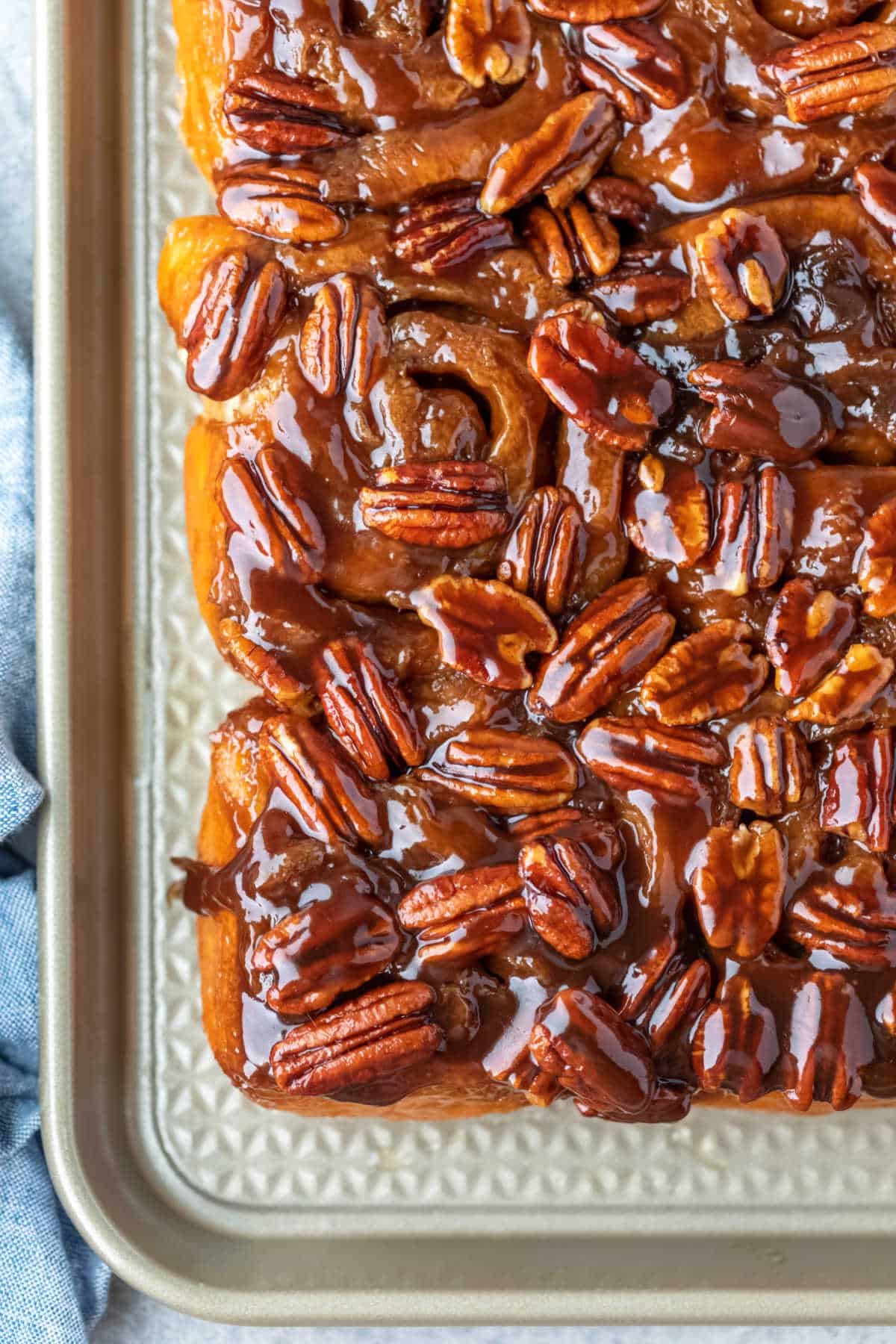 A pan of maple sticky buns inverted on a baking sheet.