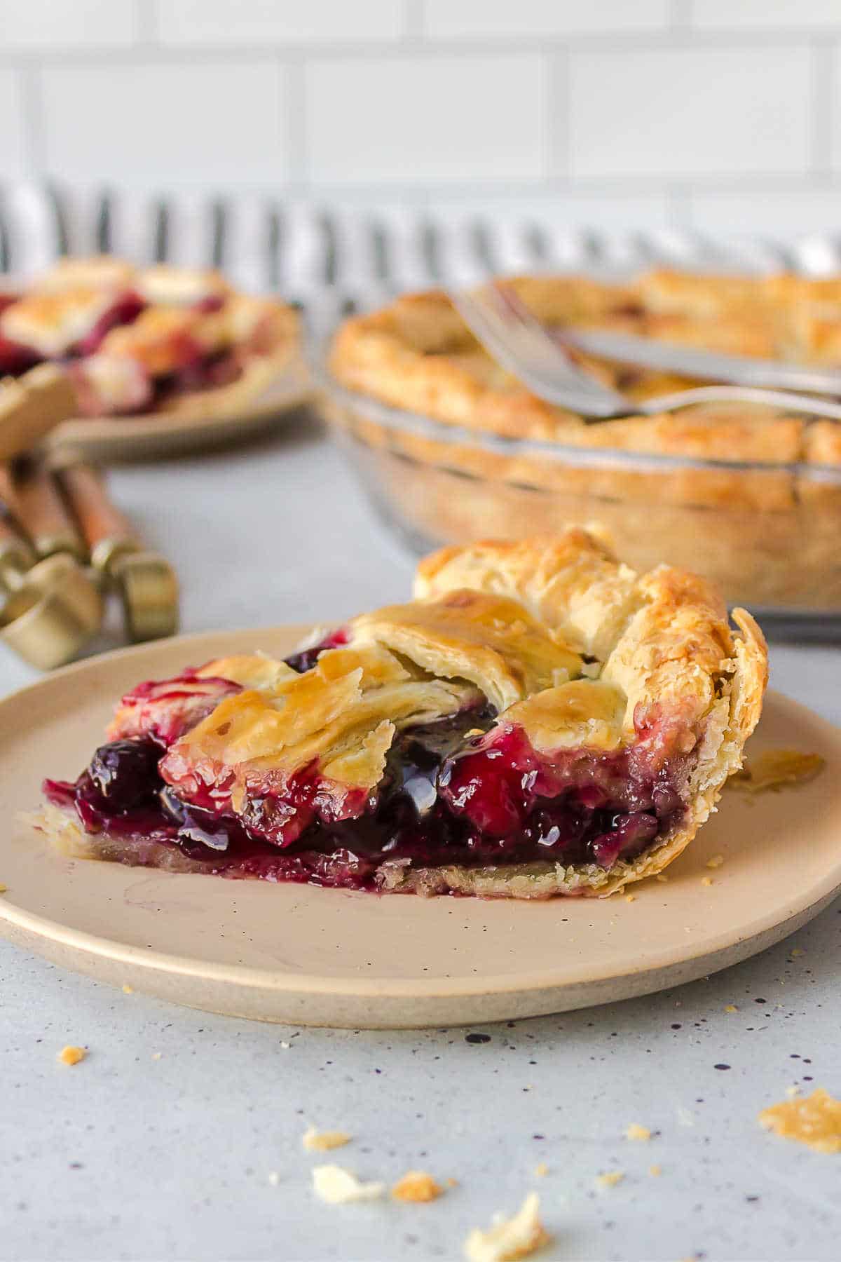 Slice of berry pie on a plate. 