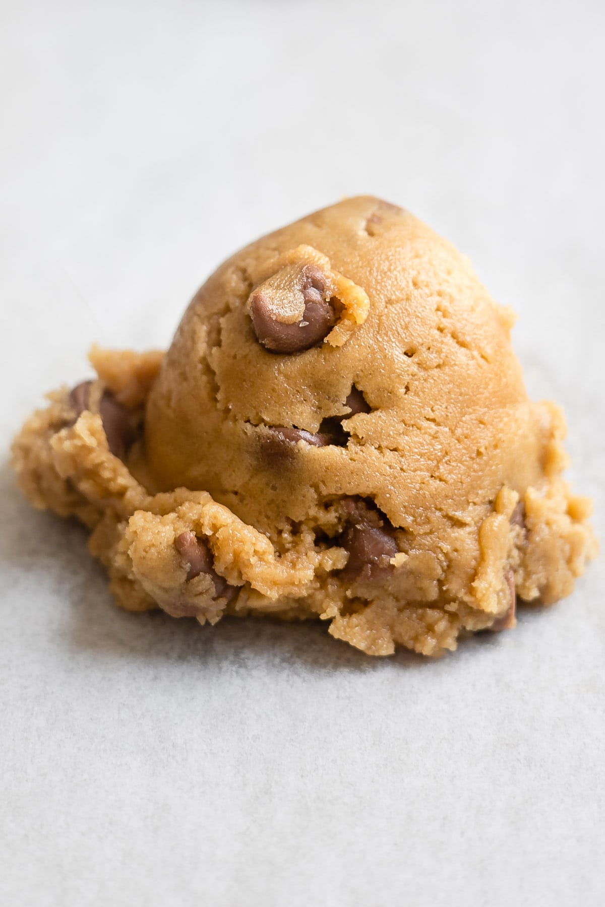 A scoop of chocolate chip cookie dough. 