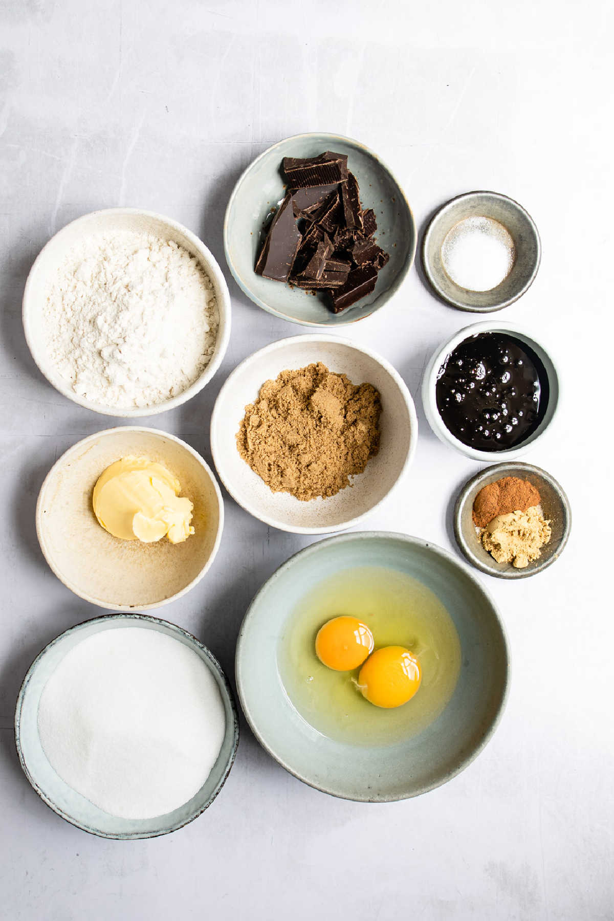 Ingredients for gingerbread brownies in bowls. 