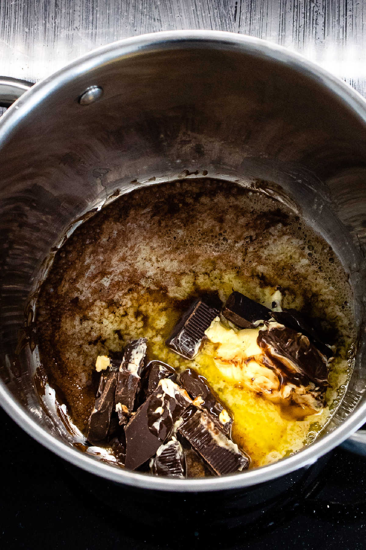 Butter and chocolate melting in a pot.