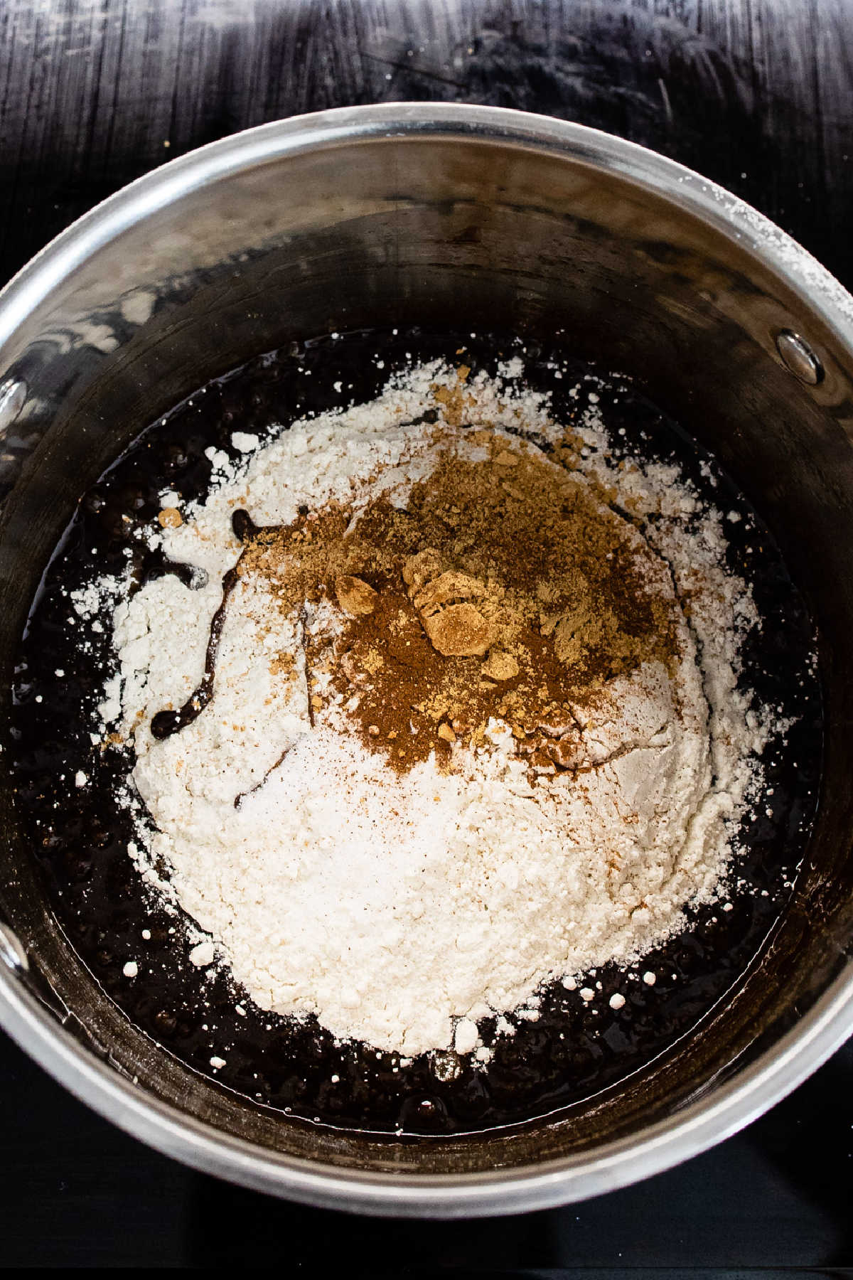 Dry ingredients in a pot of wet ingredients.