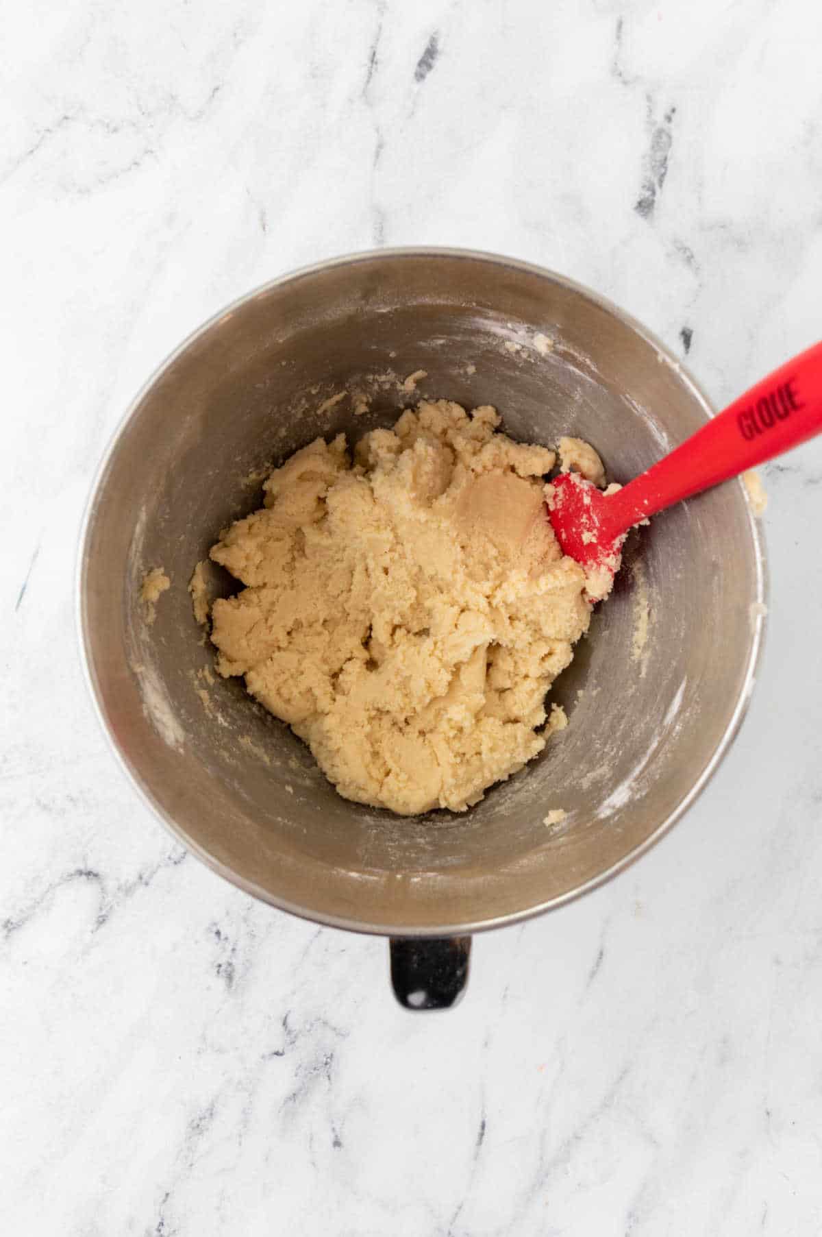 Wet and dry ingredients for Grinch cookies mixed together. 