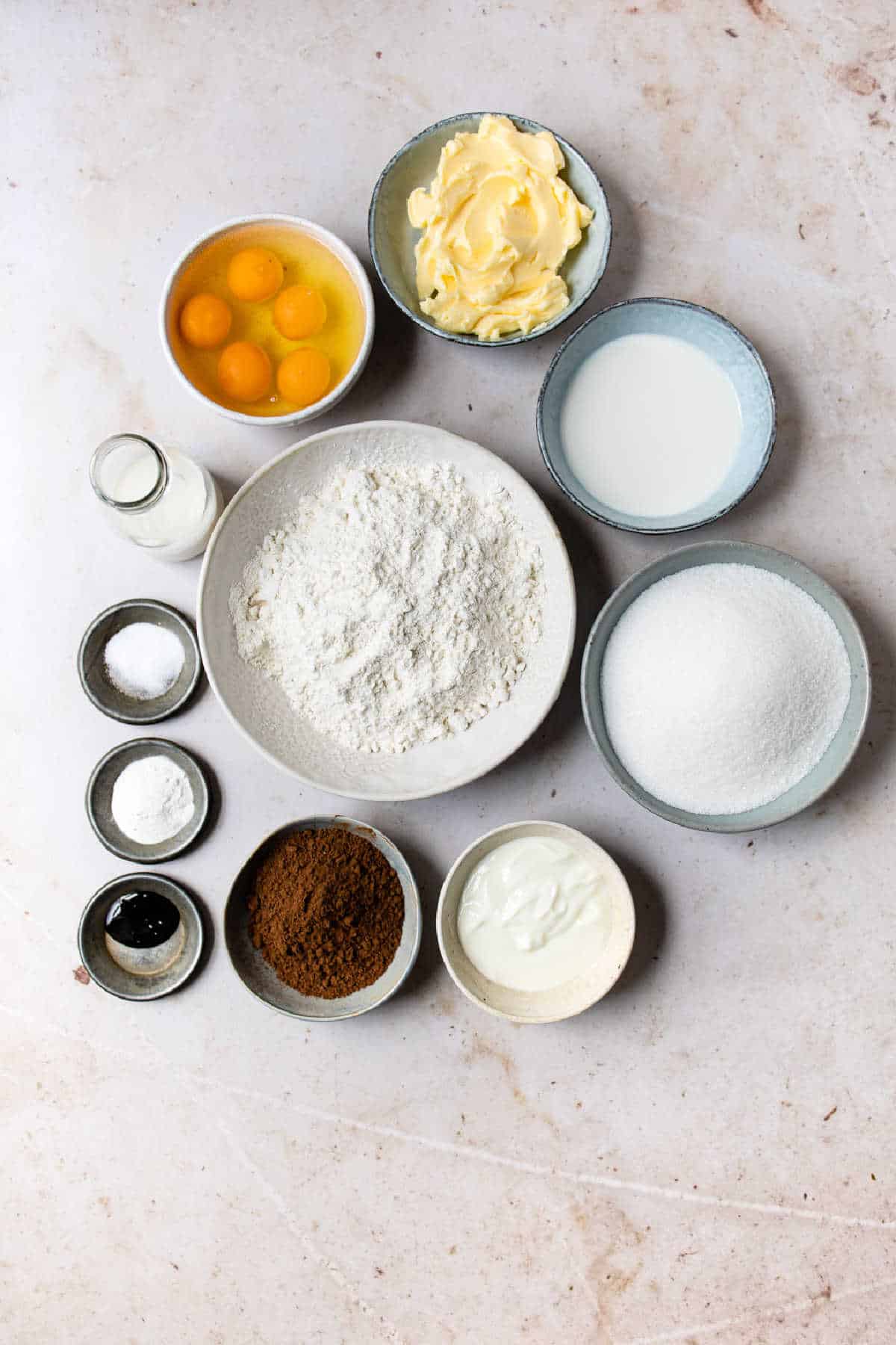 Ingredients for red velvet marble cake in dishes.