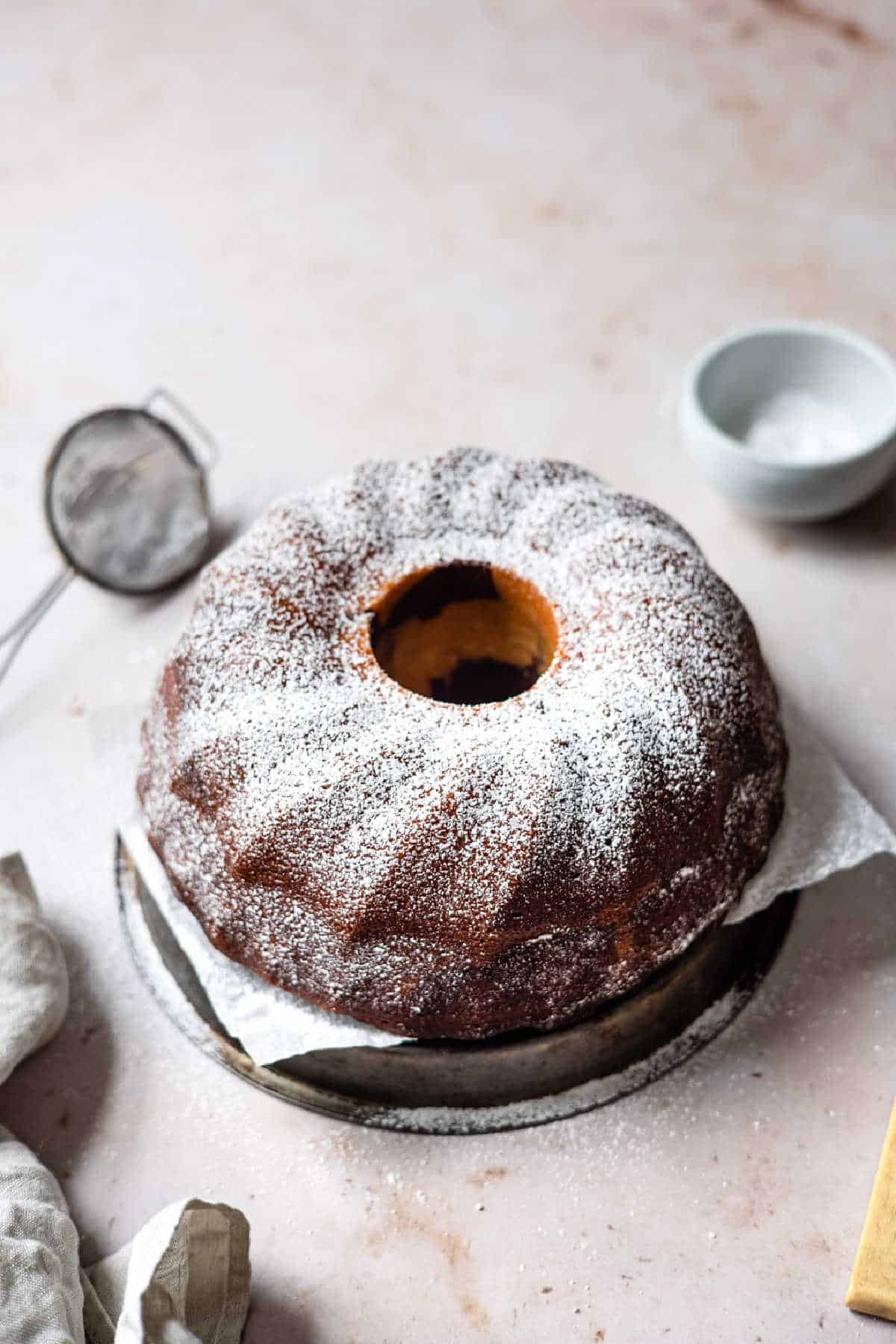 Red Velvet Marble Cake Red velvet marble cake dusted with powdered sugar.