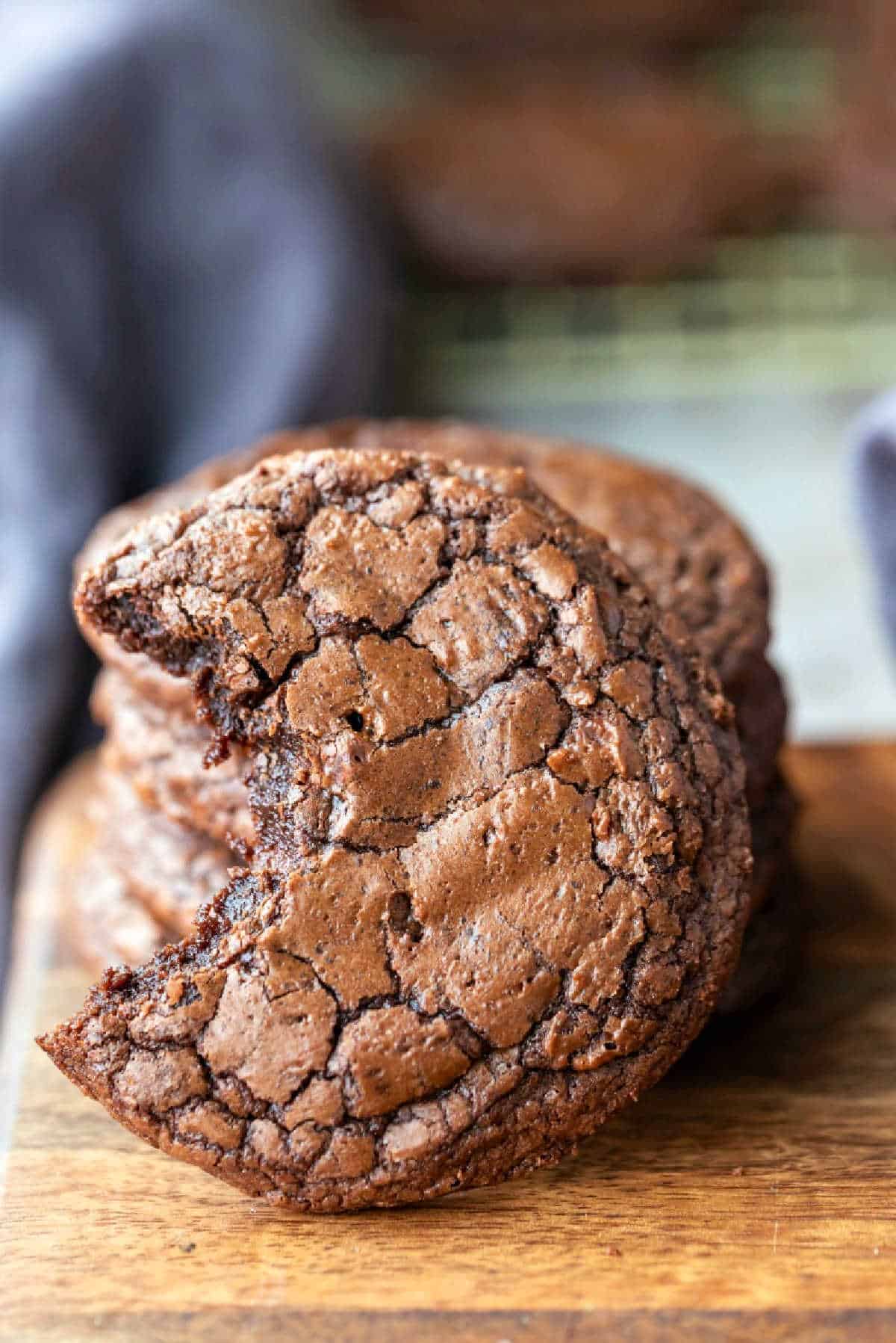 Brownie Cookie Recipe Brownie cookie standing up against a stack of brownie cookies.