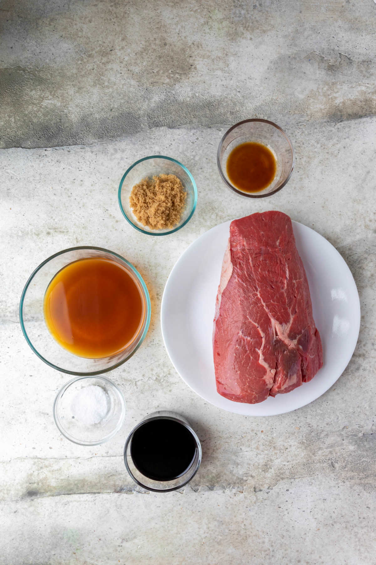 Ingredients for crock pot balsamic beef in dishes. 