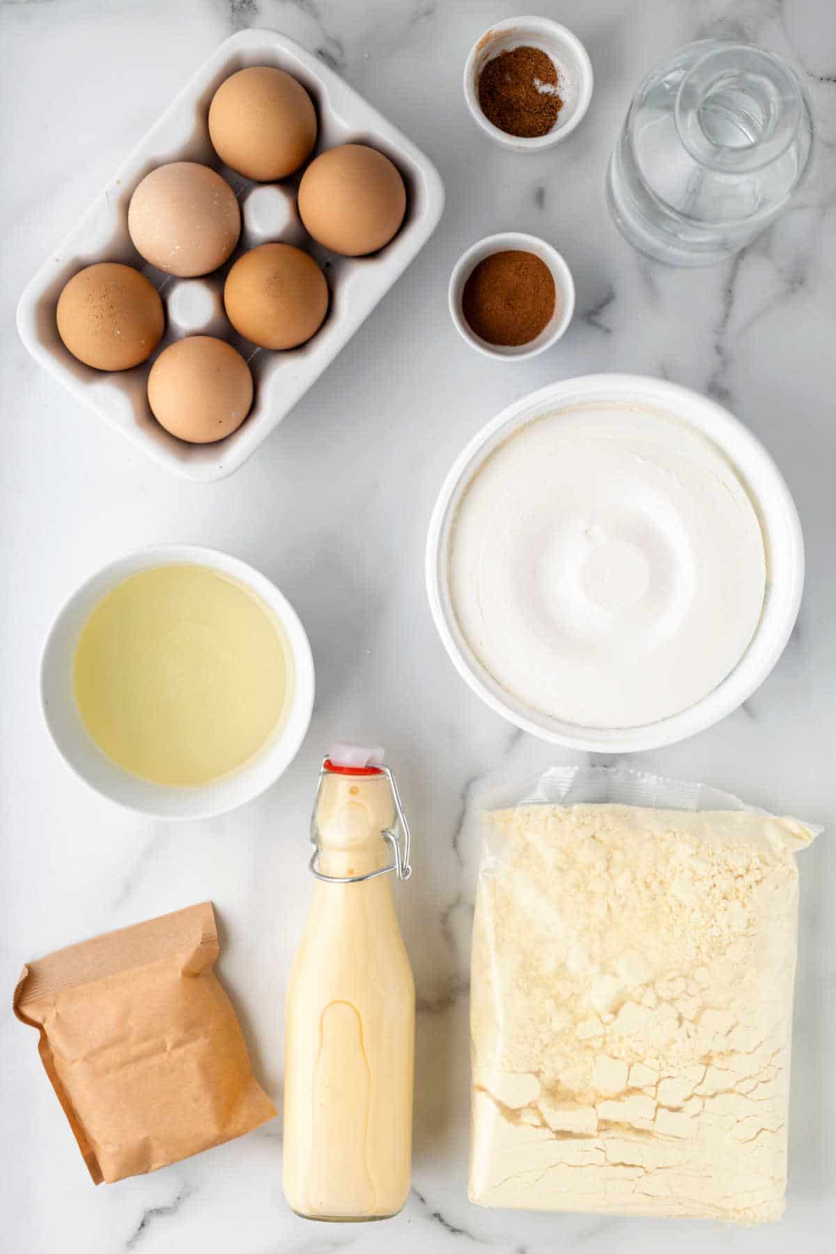 Ingredients for eggnog poke cake in dishes. 