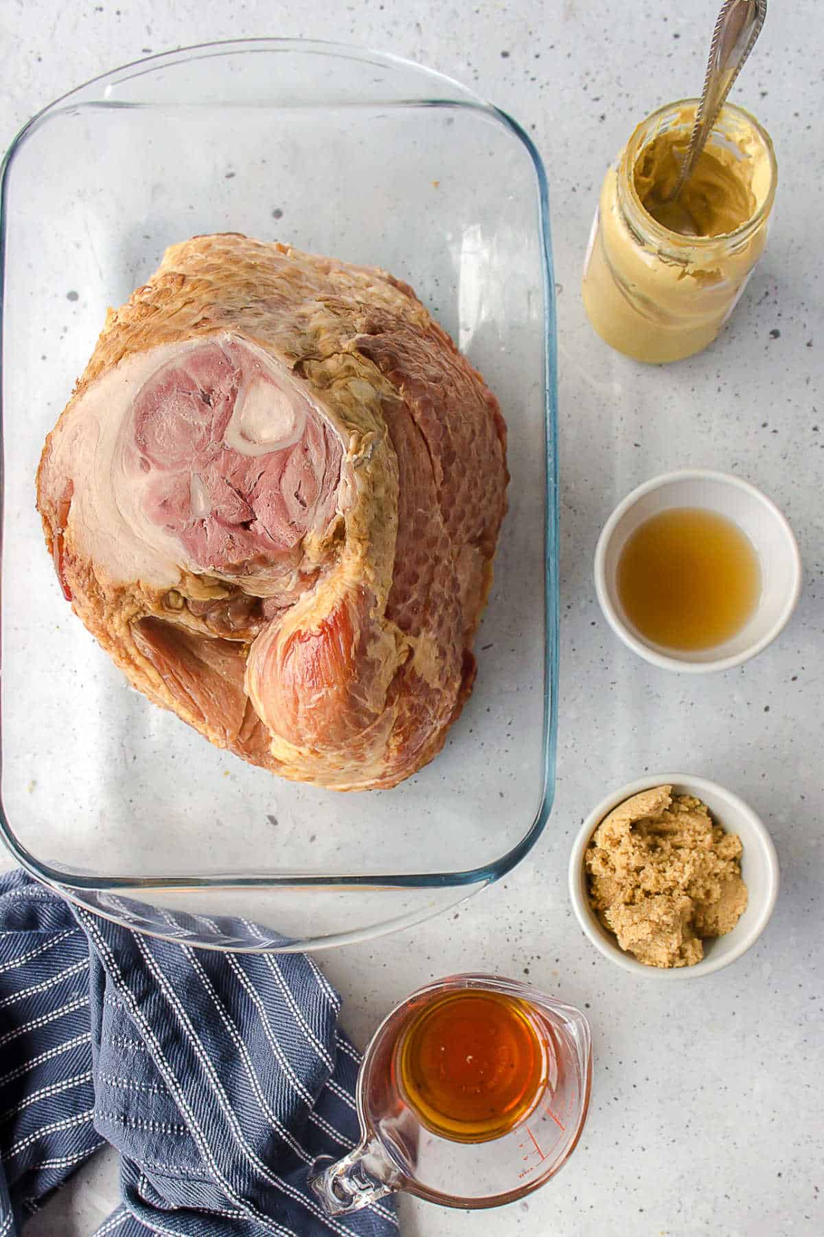 Ingredients for maple glazed ham in dishes. 