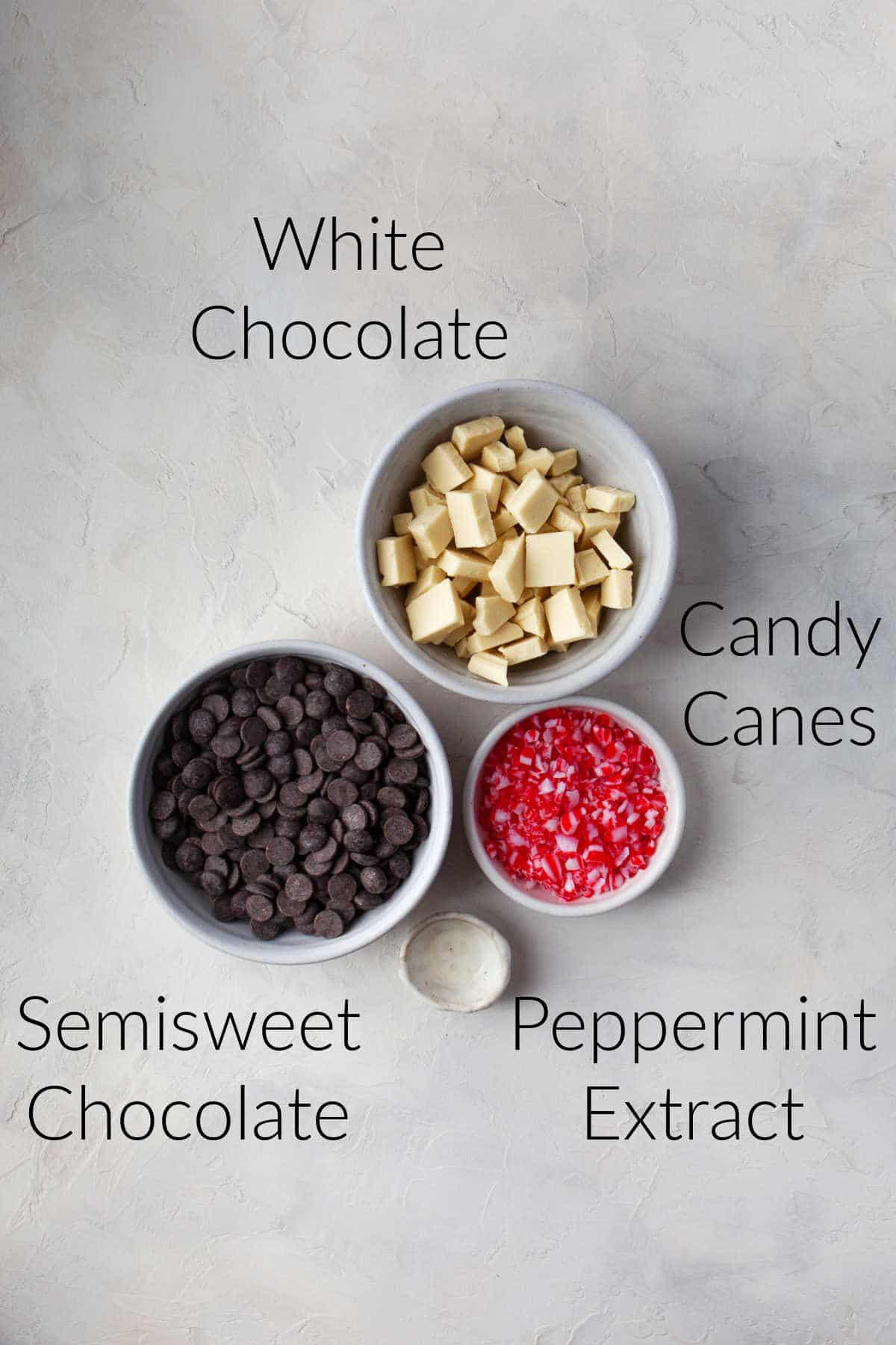 Ingredients for peppermint bark in dishes with labels. 