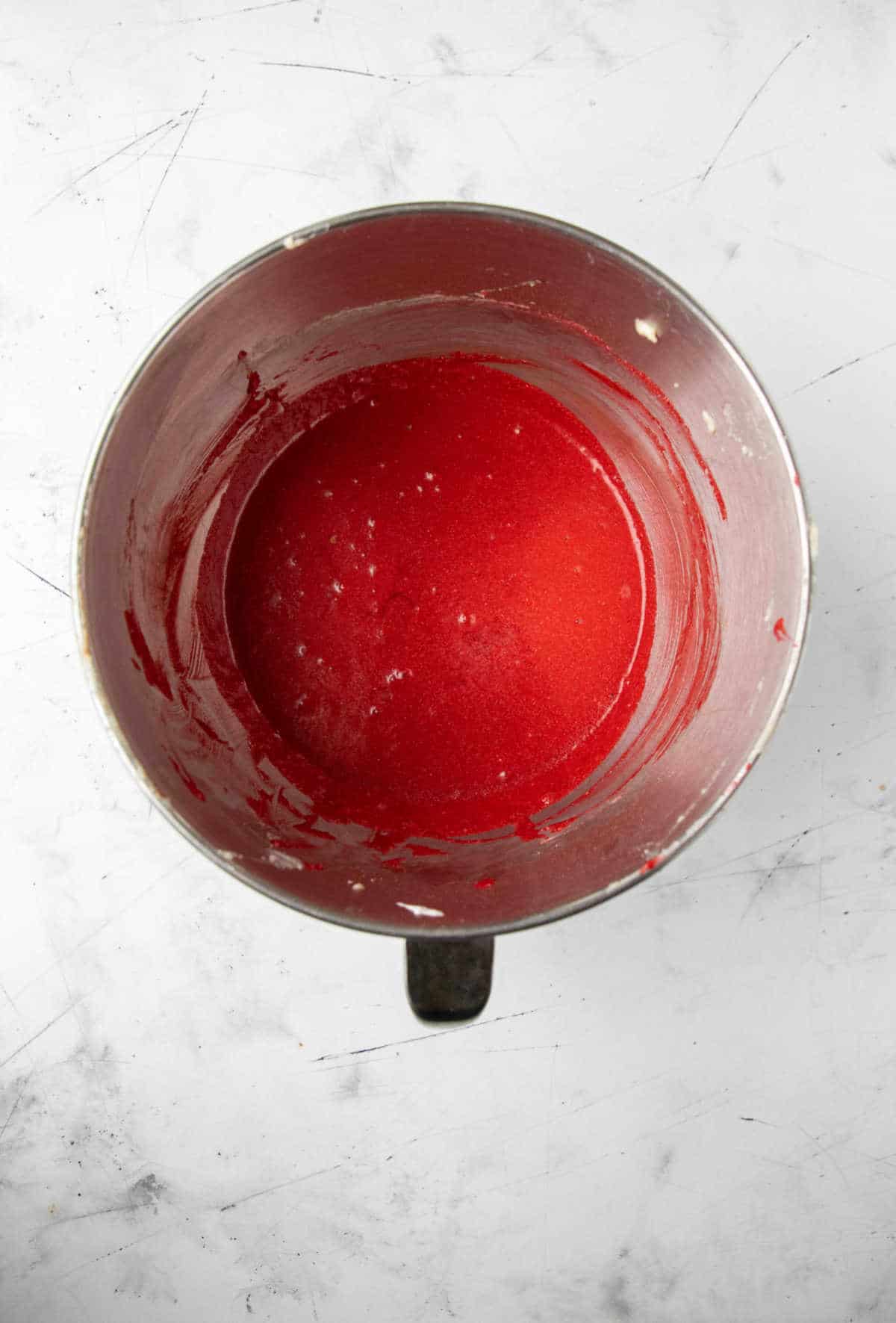 Red food coloring mixed into wet ingredients. 