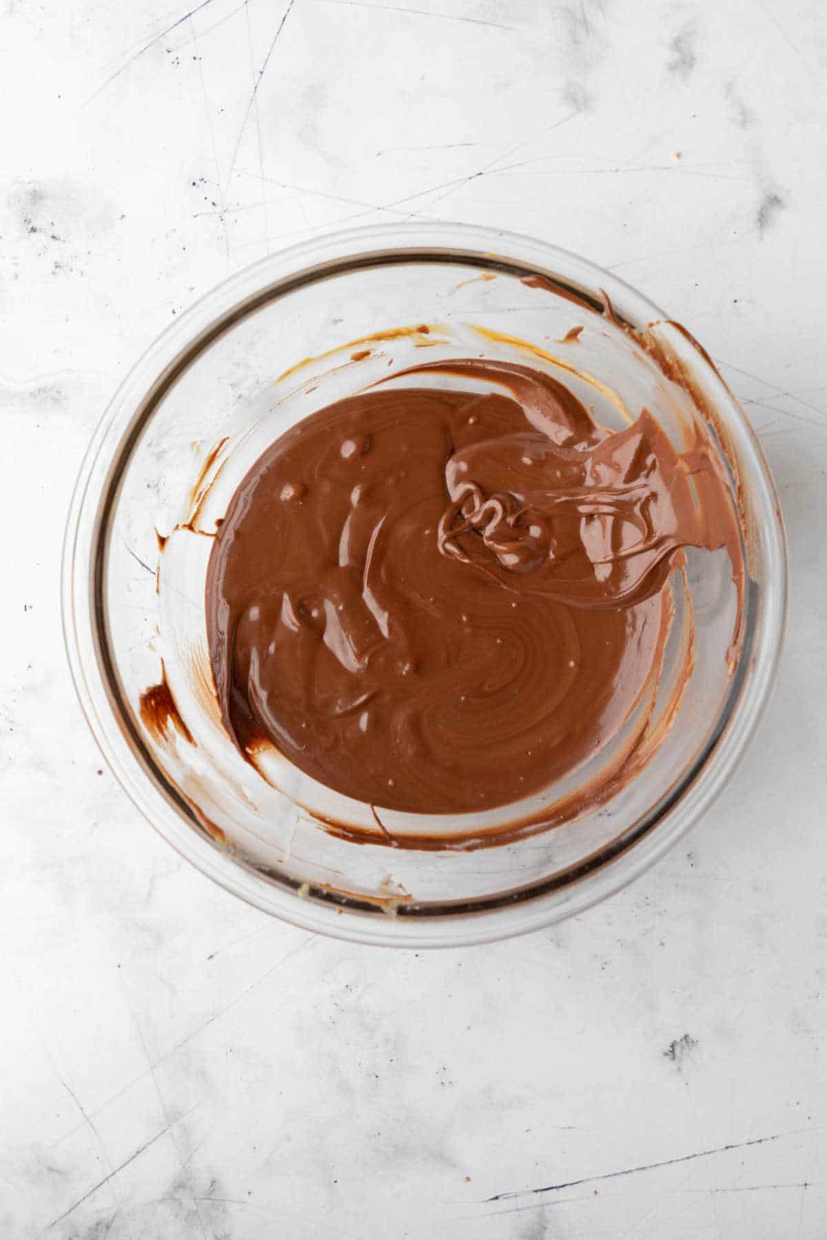 Melted peanut butter and chocolate in a mixing bowl. 