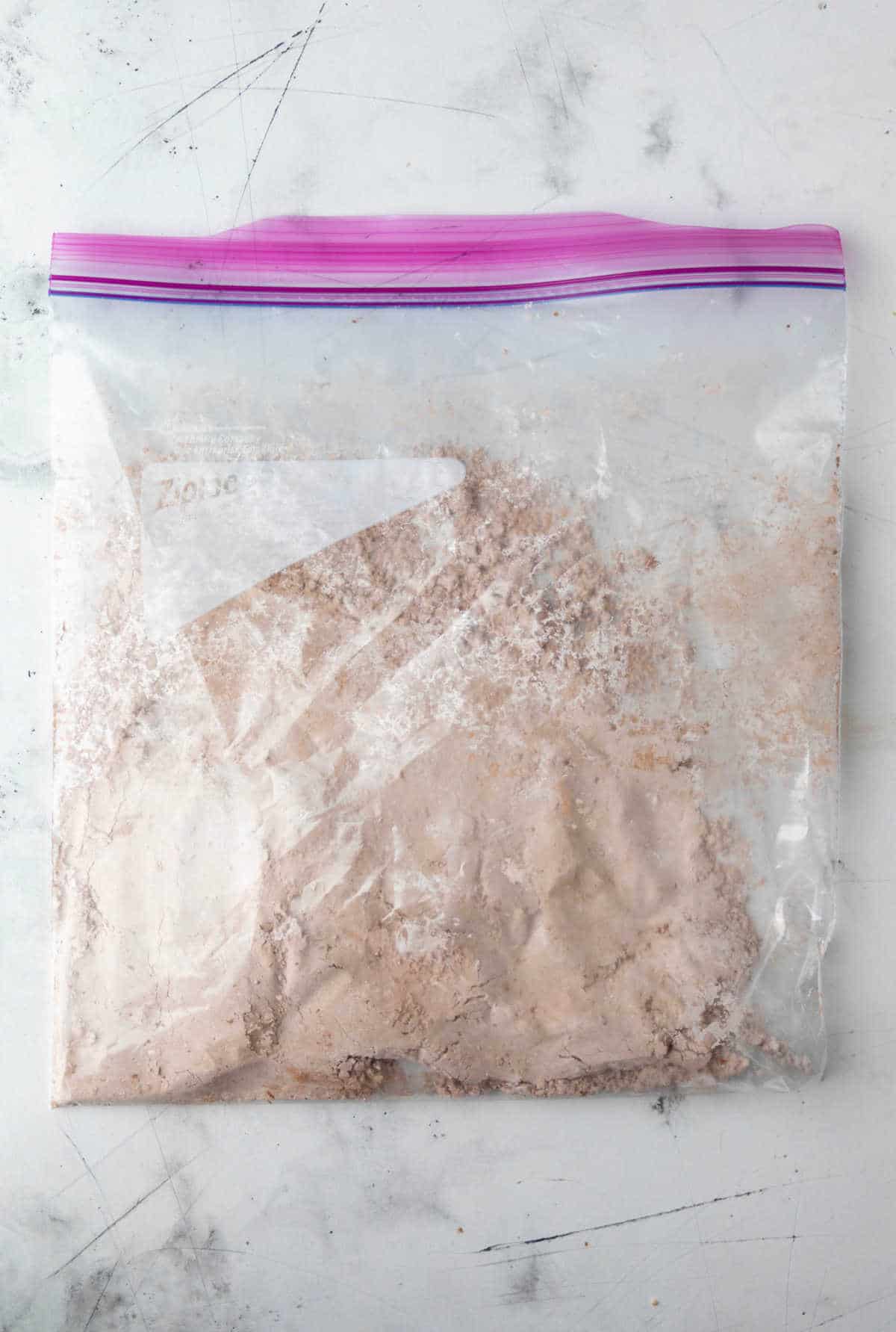 Cocoa powder and powdered sugar in a resealable baggie. 