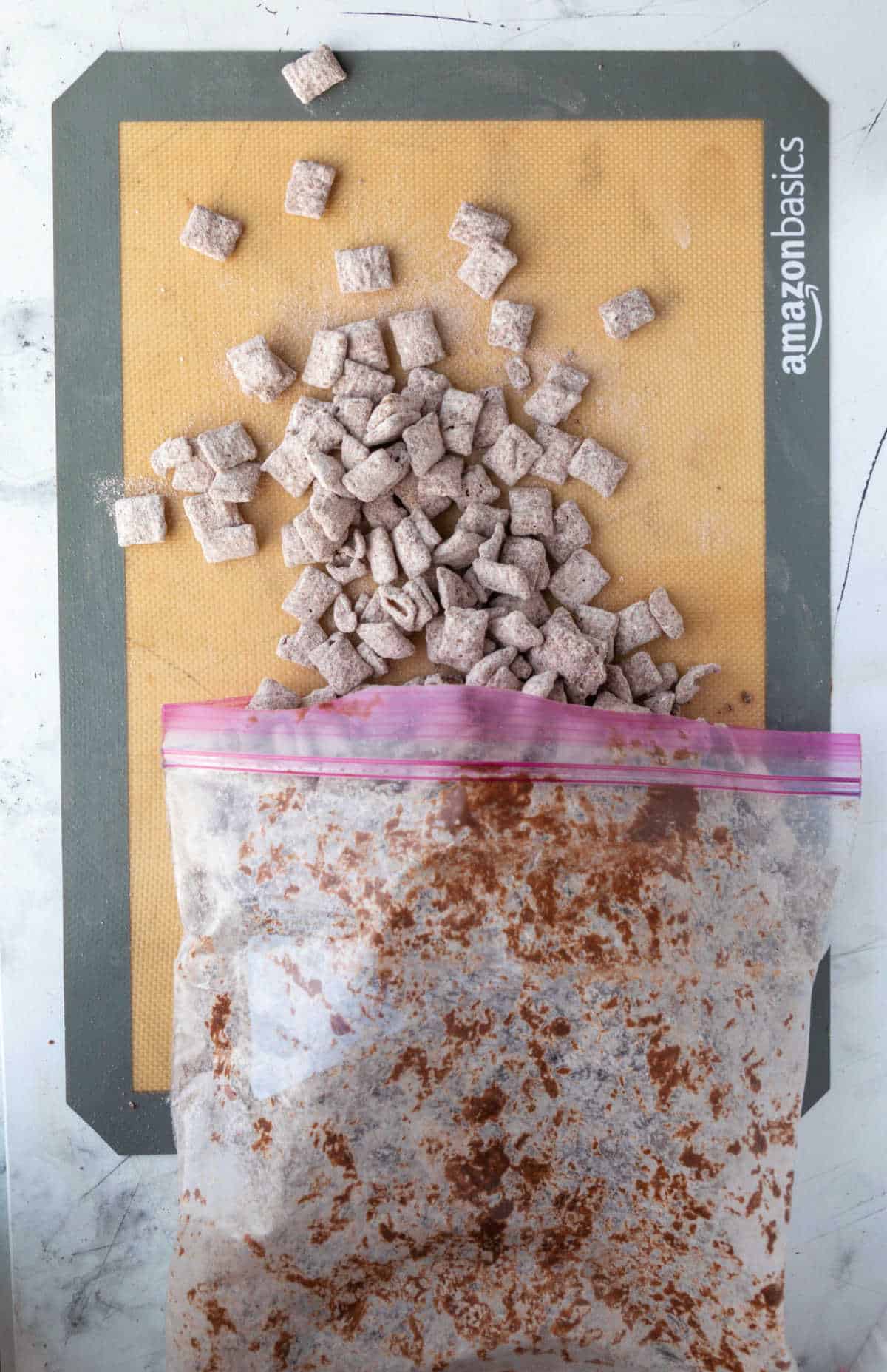 Muddy buddies spread on a silicone baking mat. 