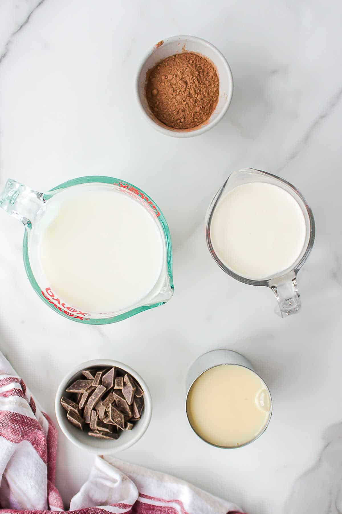 Ingredients for slow cooker hot chocolate in dishes.