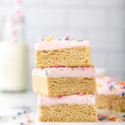 Stack of sugar cookie bars on a white platter.