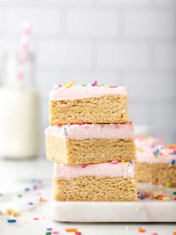Stack of sugar cookie bars on a white platter.