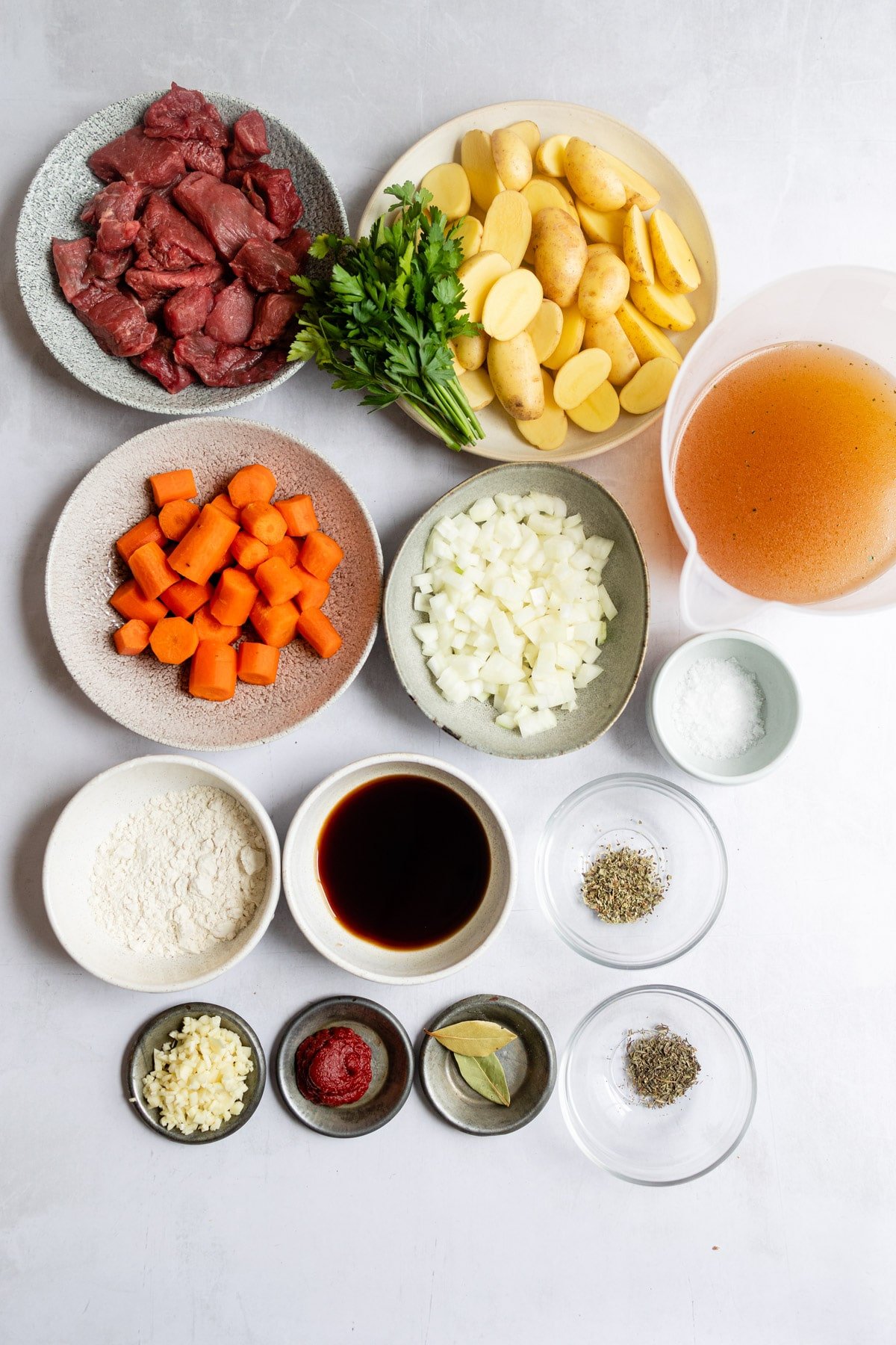 Ingredients for beef stew in dishes. 