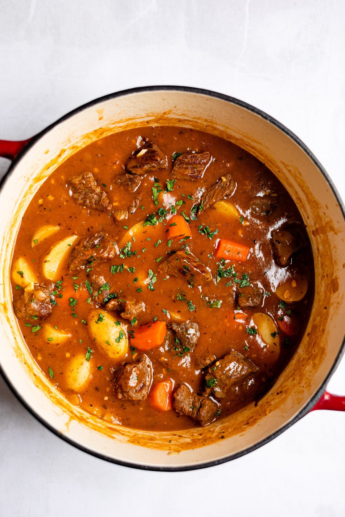 Beef stew in a Dutch oven. 