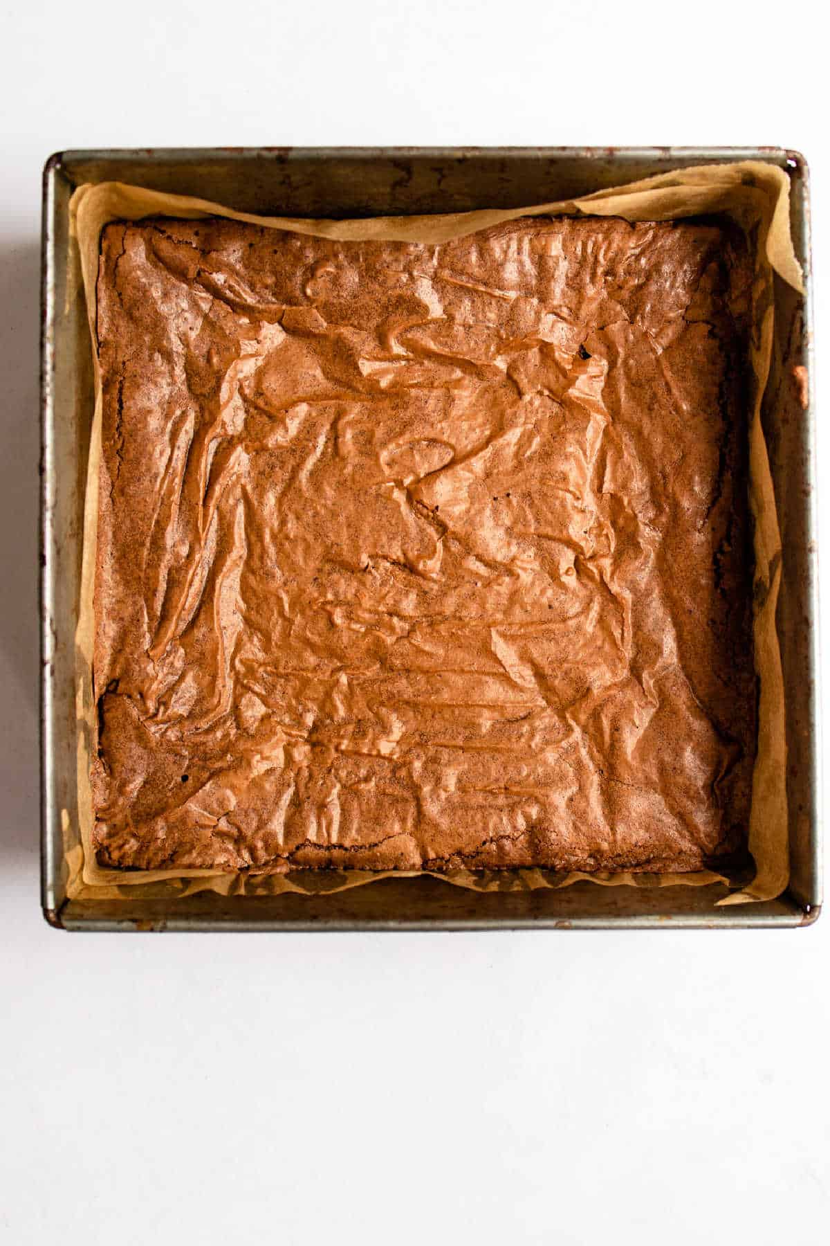 Baked brownie in a 9 by 9 pan.