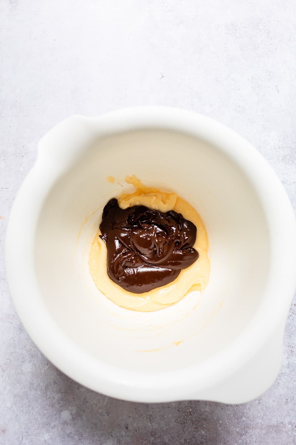 Melted chocolate mixture with egg yolk mixture. 
