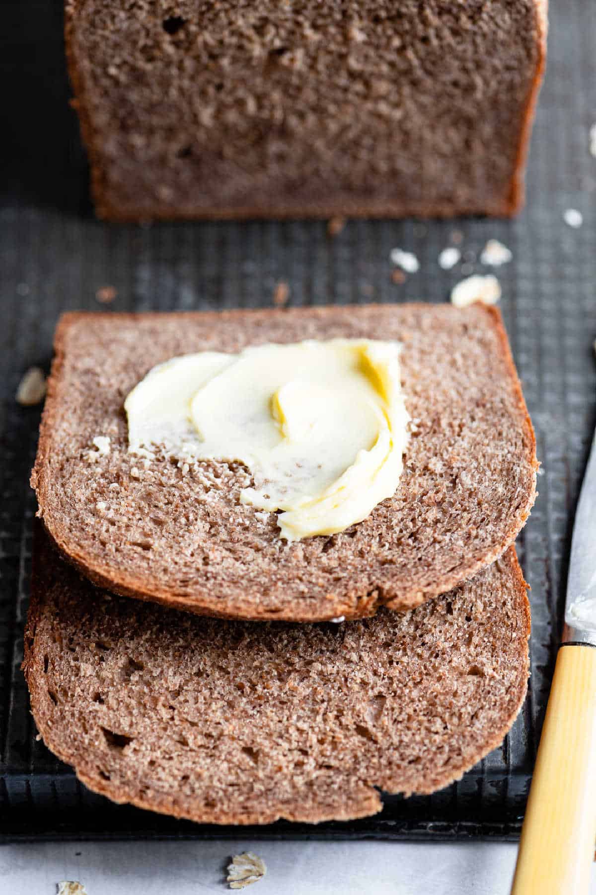 Partially buttered slice of outback bread.