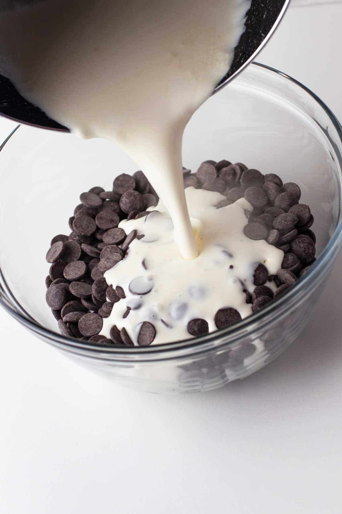 Hot cream pouring over chocolate chips. 