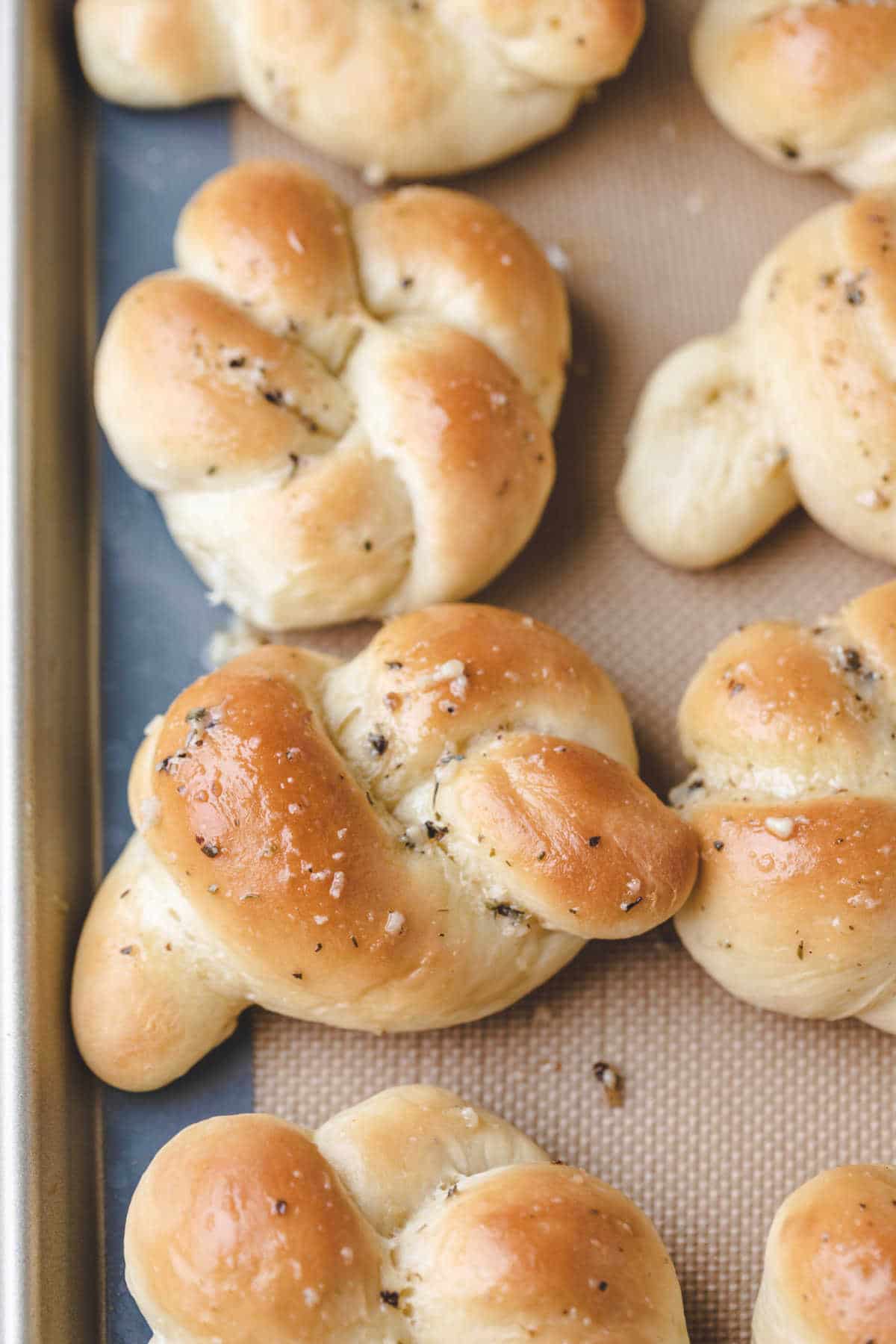 Garlic knots on a baking tray.