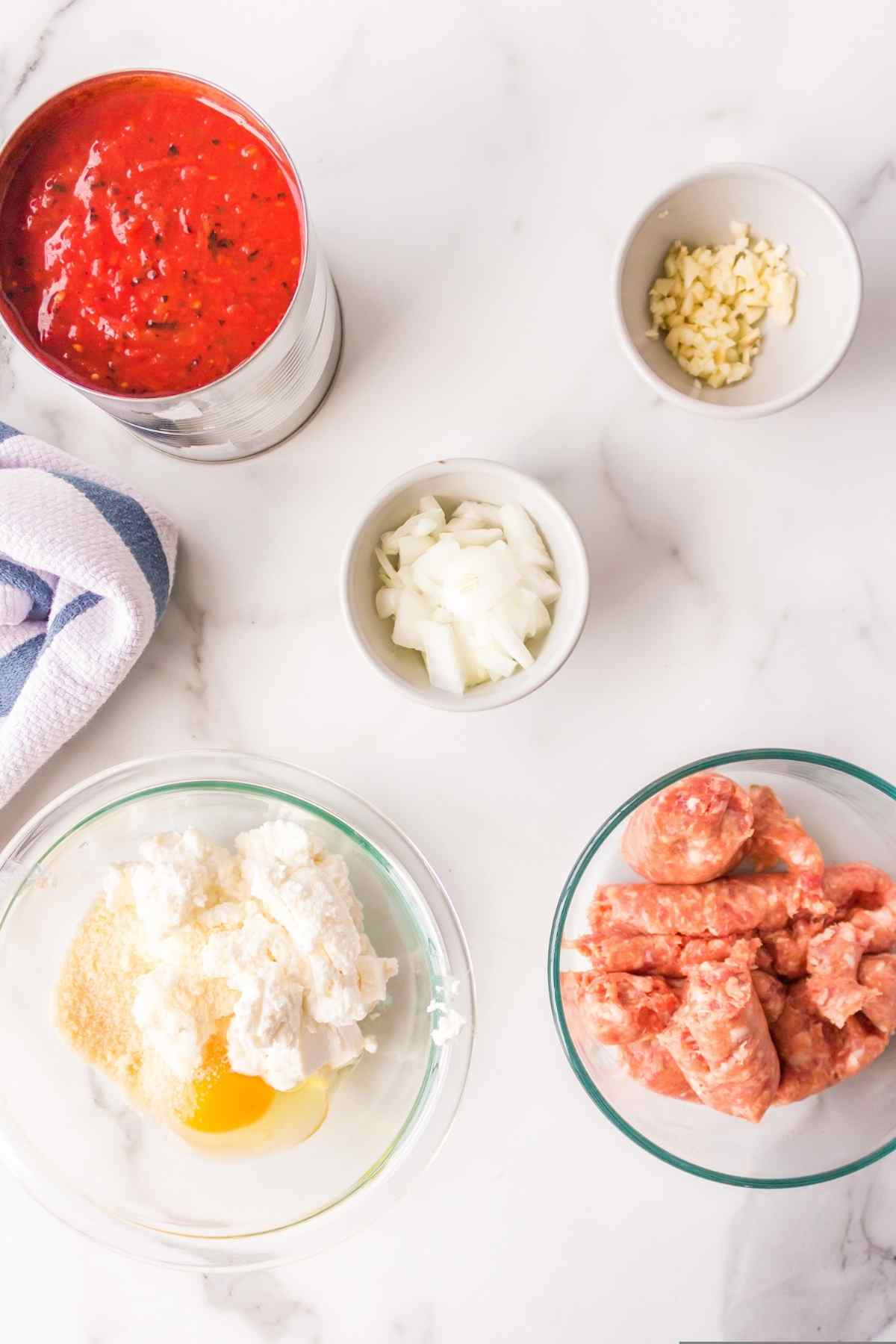 Ingredients for lasagna dip in dishes. 