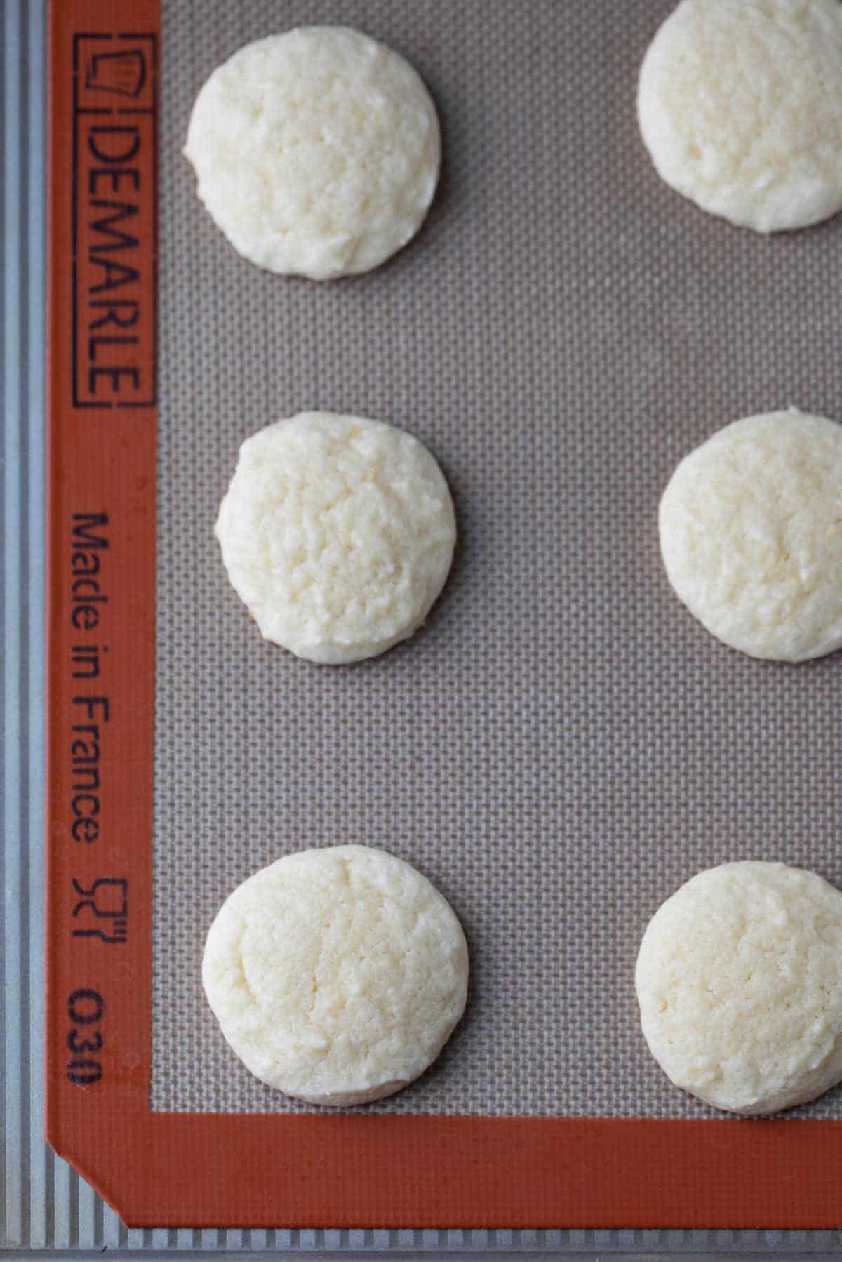 Baked lemon cookies on a baking sheet. 